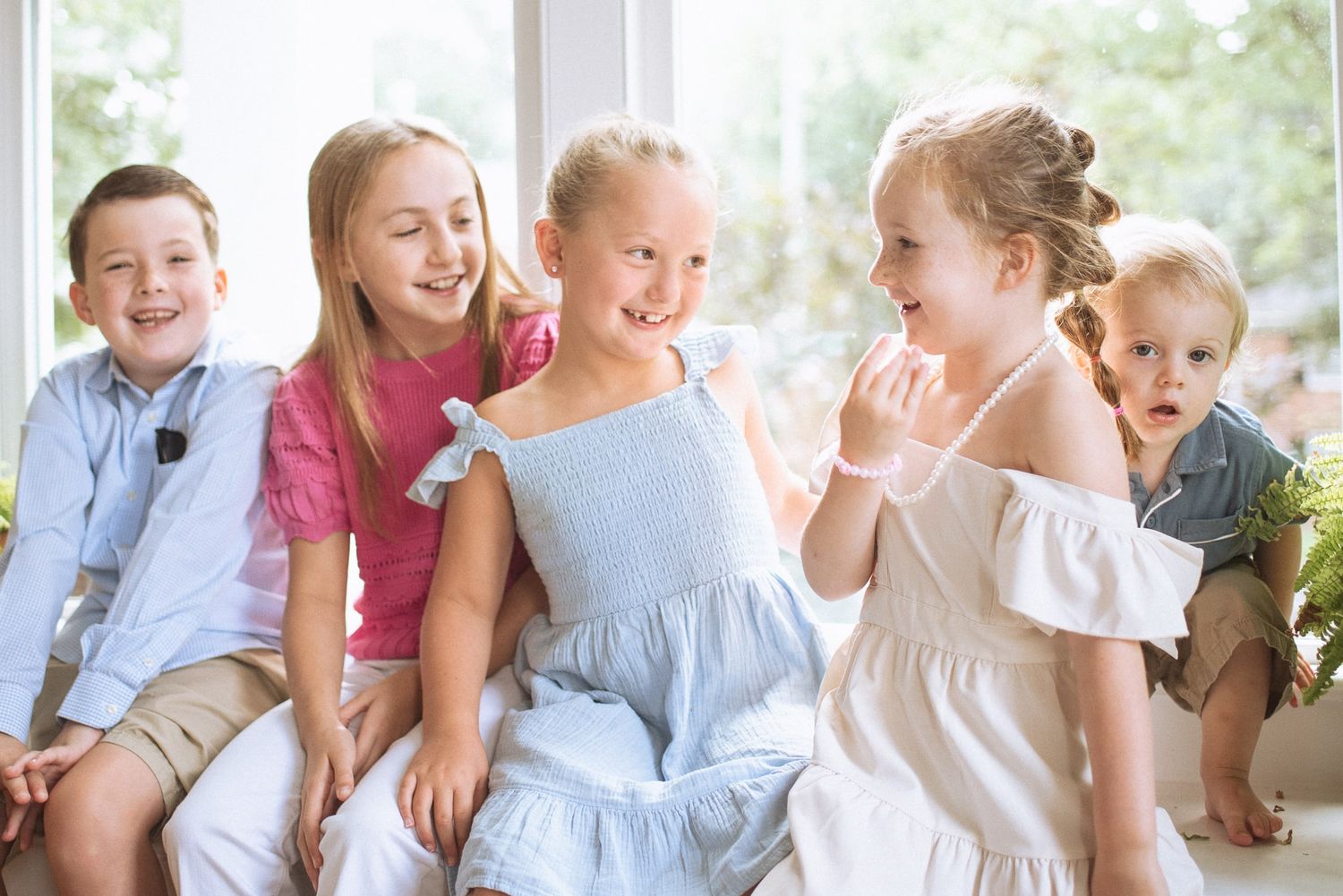 A collection of joyful moments showing people sitting together on a bench in natural window light.