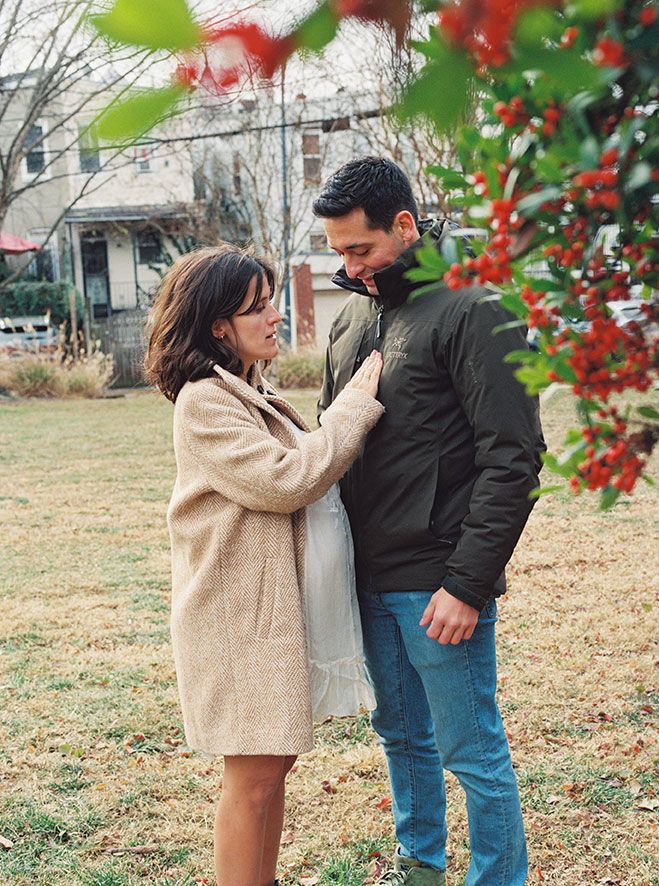 A sequence of romantic outdoor photos showing a couple embracing near winter trees with red berries.