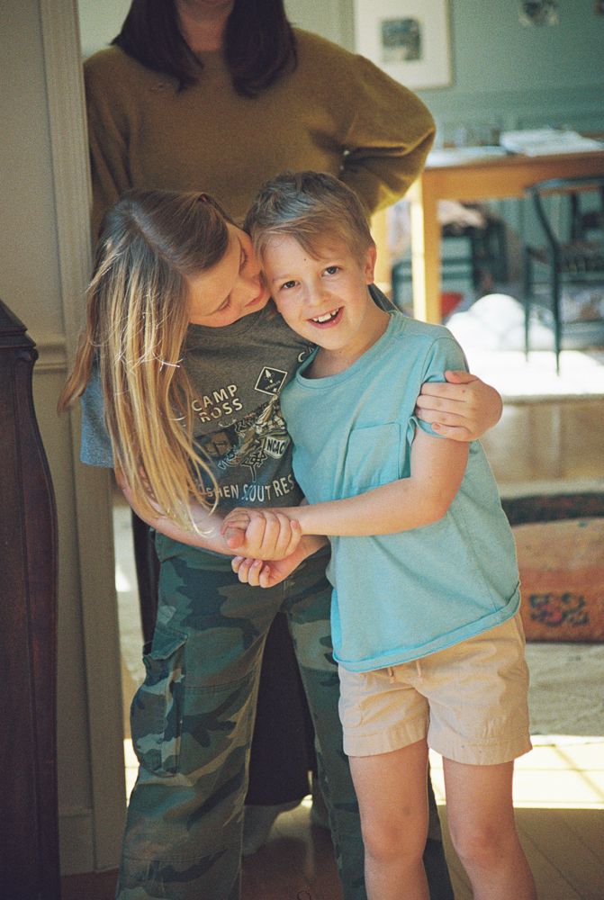 A series of candid photos showing playful interaction between two people in a sunlit home interior.
