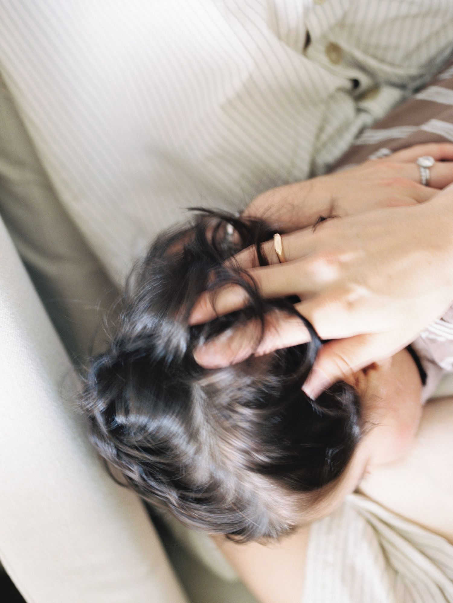 Series showing gentle massage techniques being performed on scalp with fingertips in a relaxing spa setting.