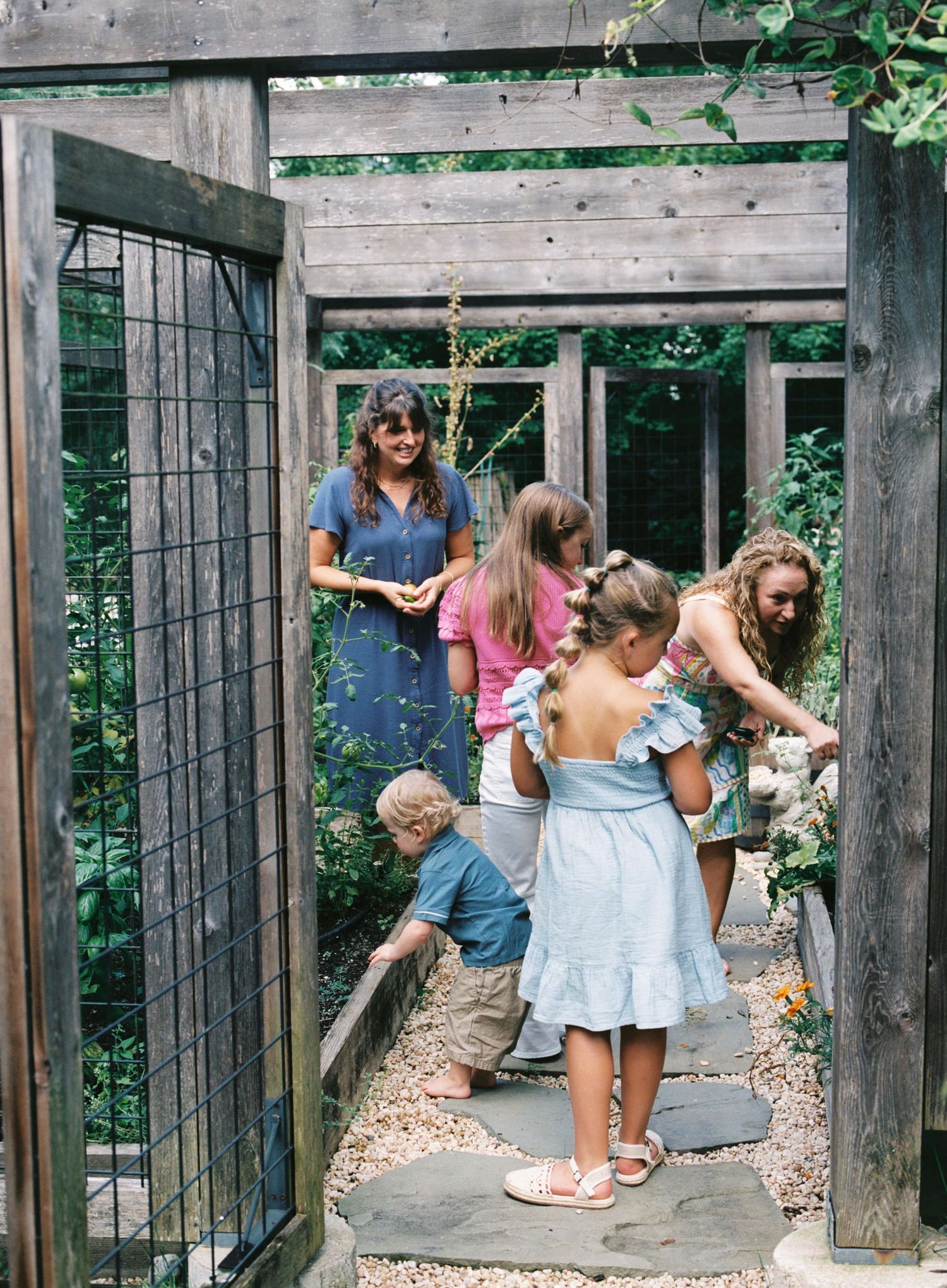 A sequence of photos showing people exploring and playing in a rustic wooden garden structure.