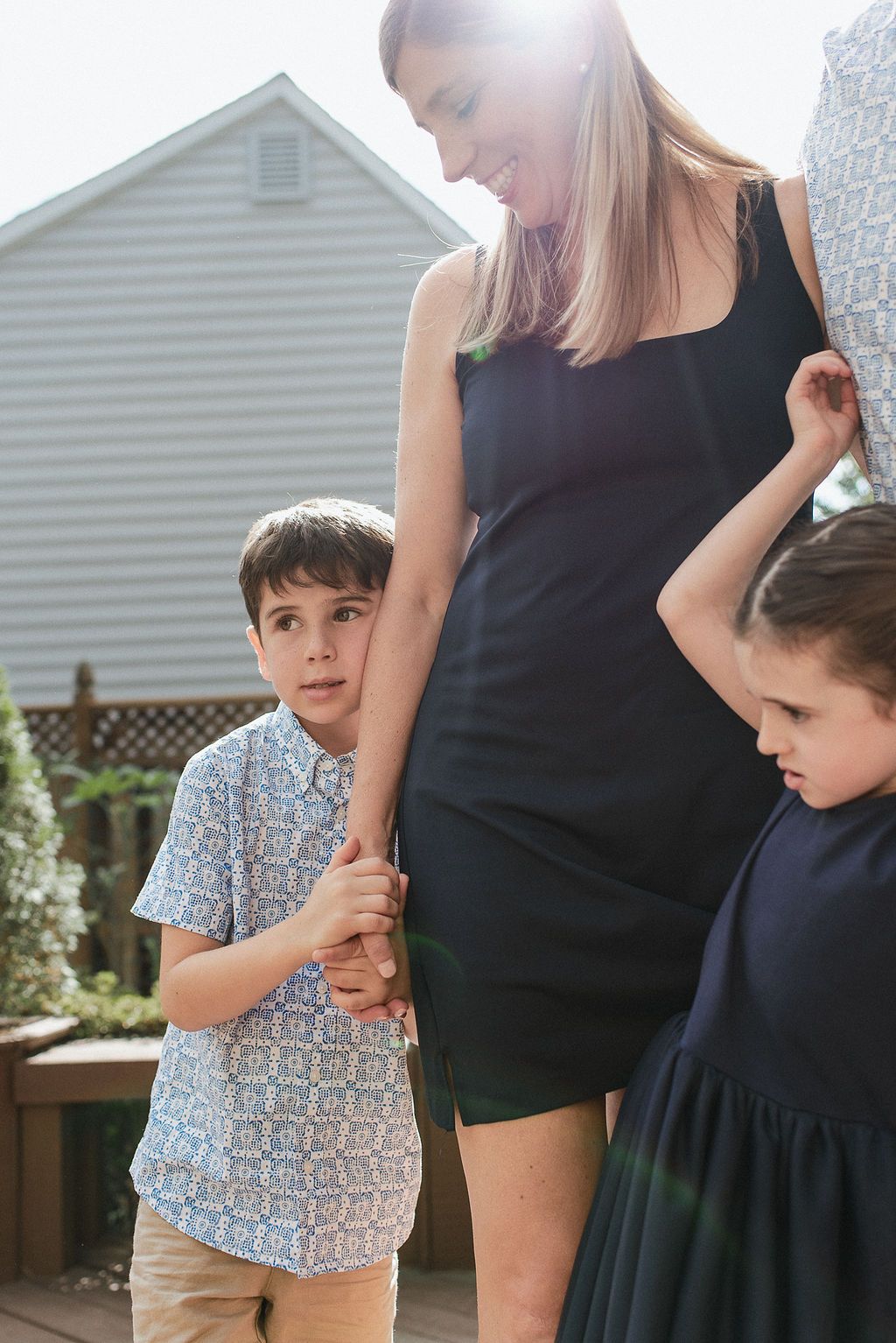 A series of candid family moments showing affectionate interactions between parents and children in casual attire.