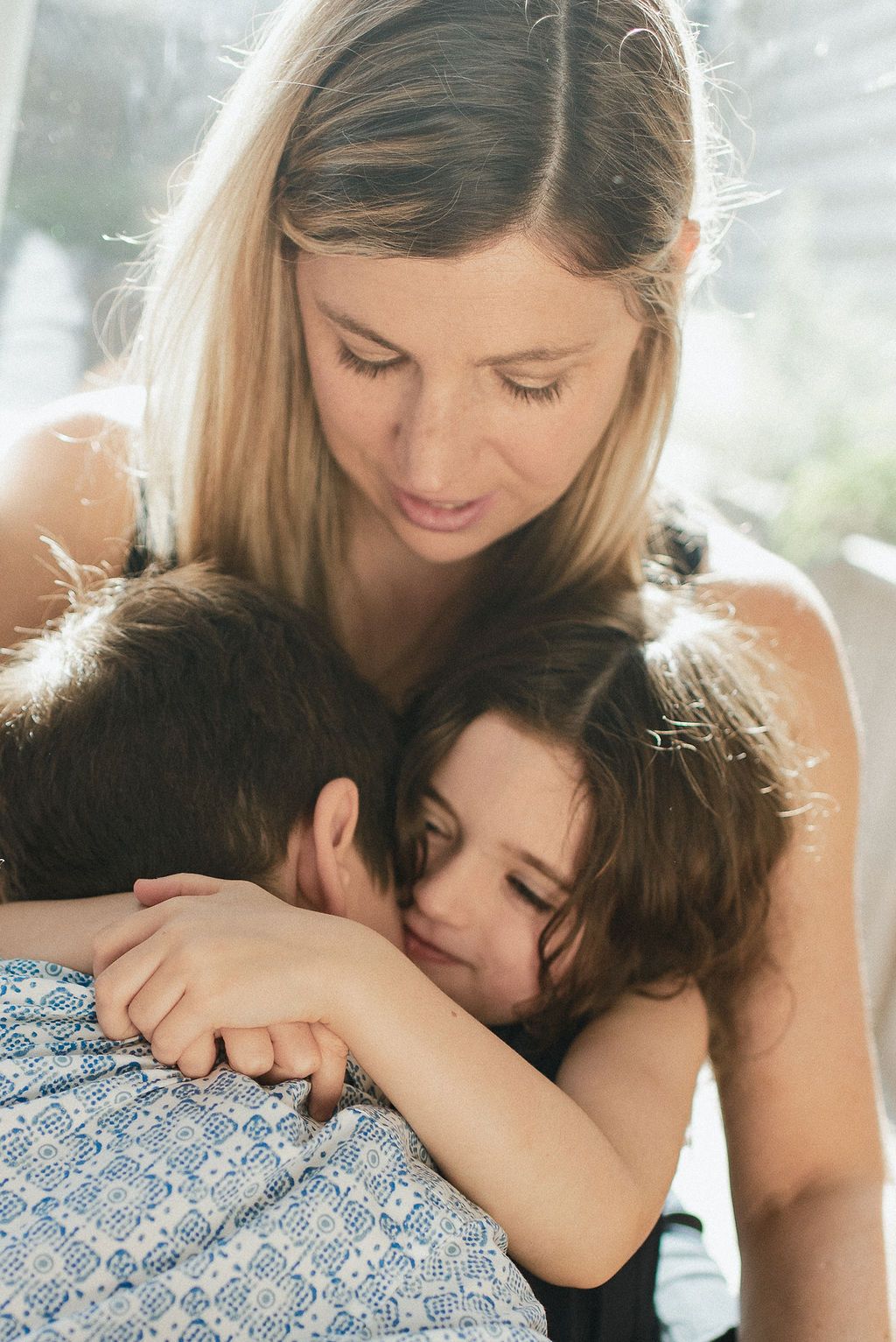 A tender moment of affection and bonding captured in soft natural lighting.