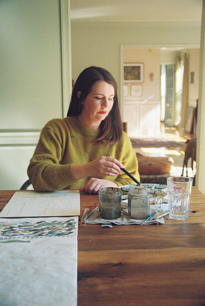 A series of photos showing someone in a yellow sweater sitting at a wooden table working on a puzzle.