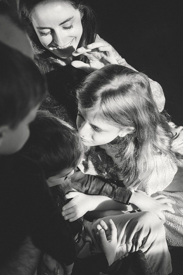 A series of black and white photographs showing tender moments between a person and a dog in intimate close-up shots.