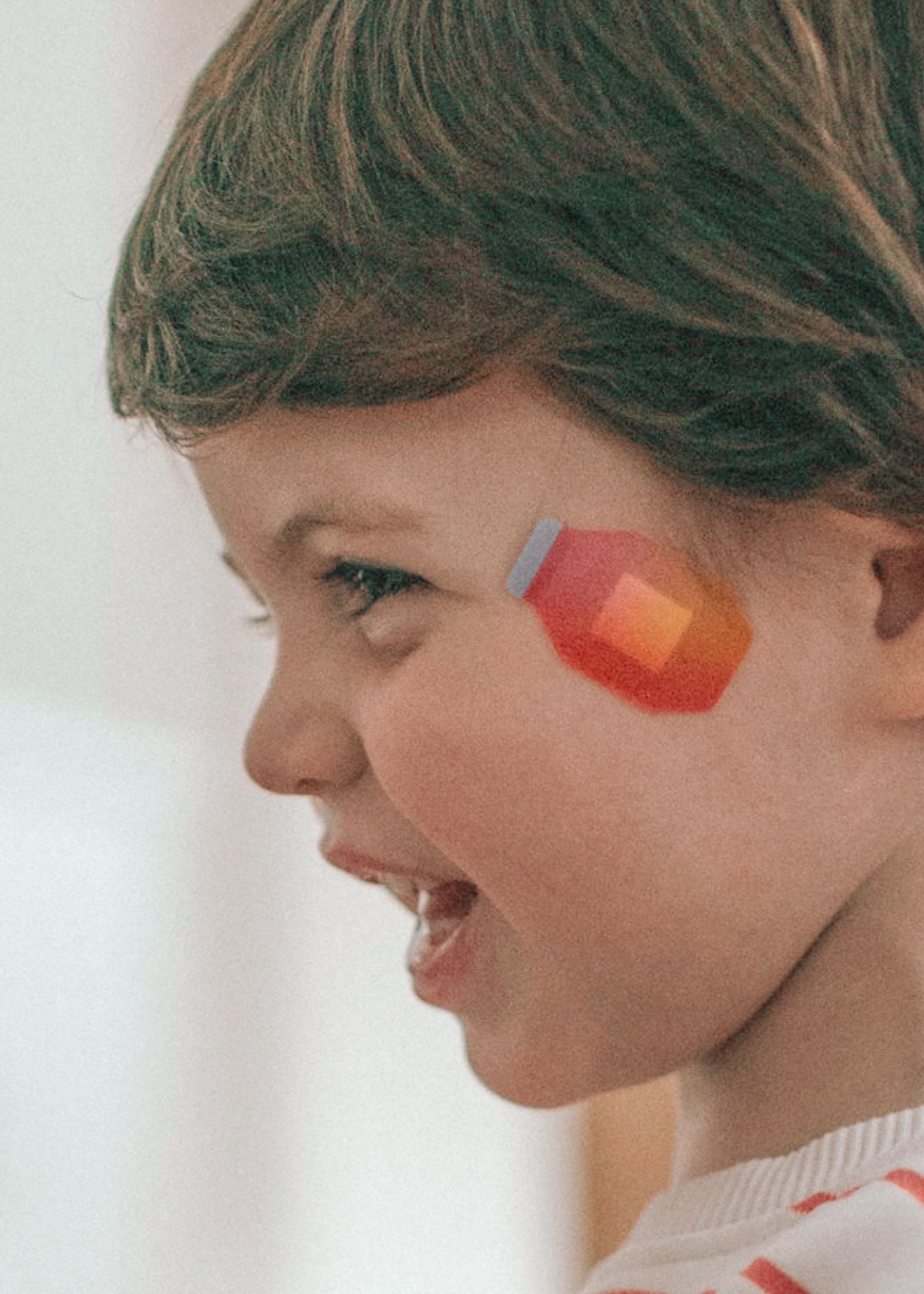 A person wearing bandages in colorful patterns on their face shown in a side profile sequence of four images.