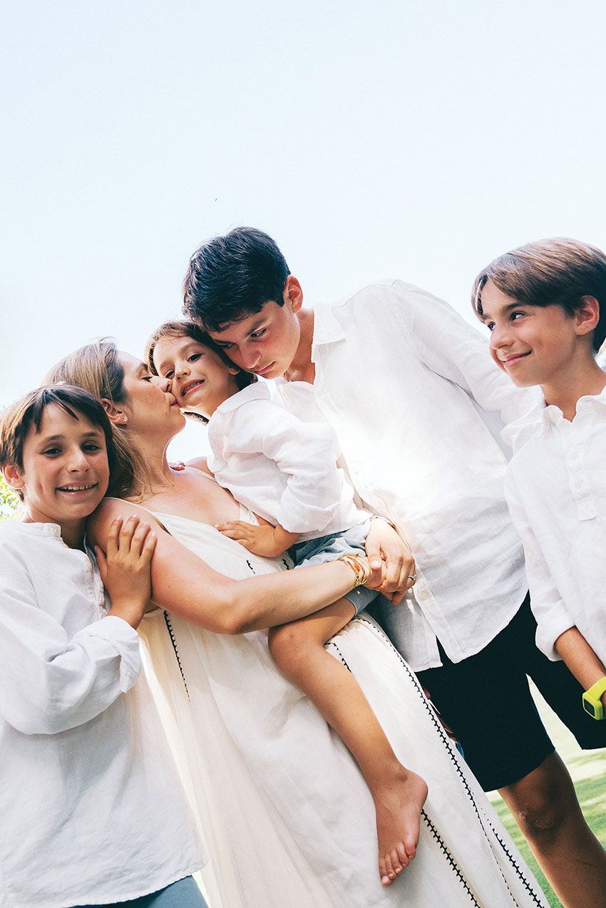 Playful group in white shirts having fun and laughing together in a candid photo sequence.