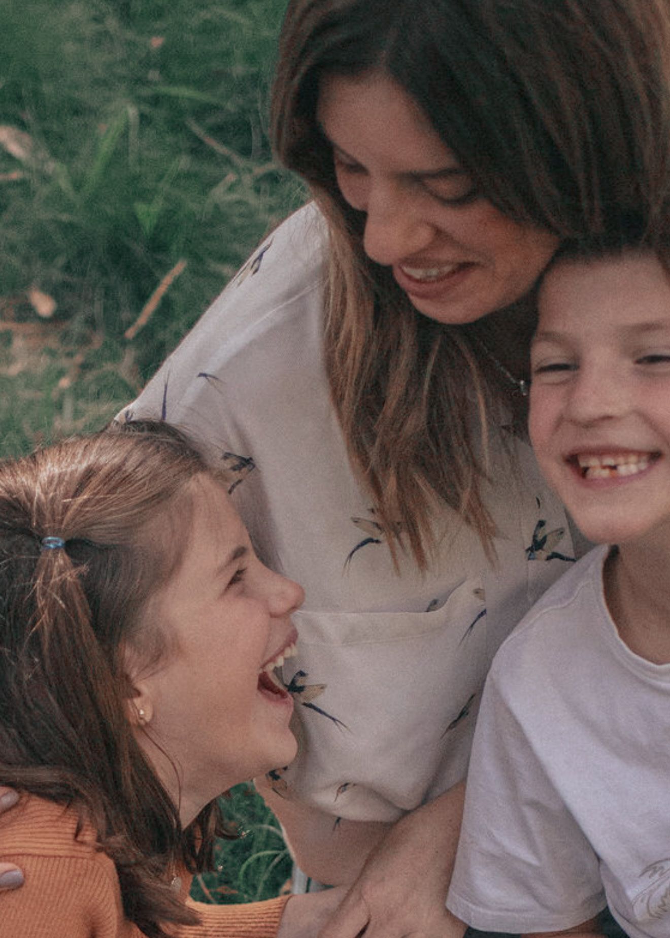 A candid series of playful family moments captured outdoors showing genuine laughter and connection in natural lighting.
