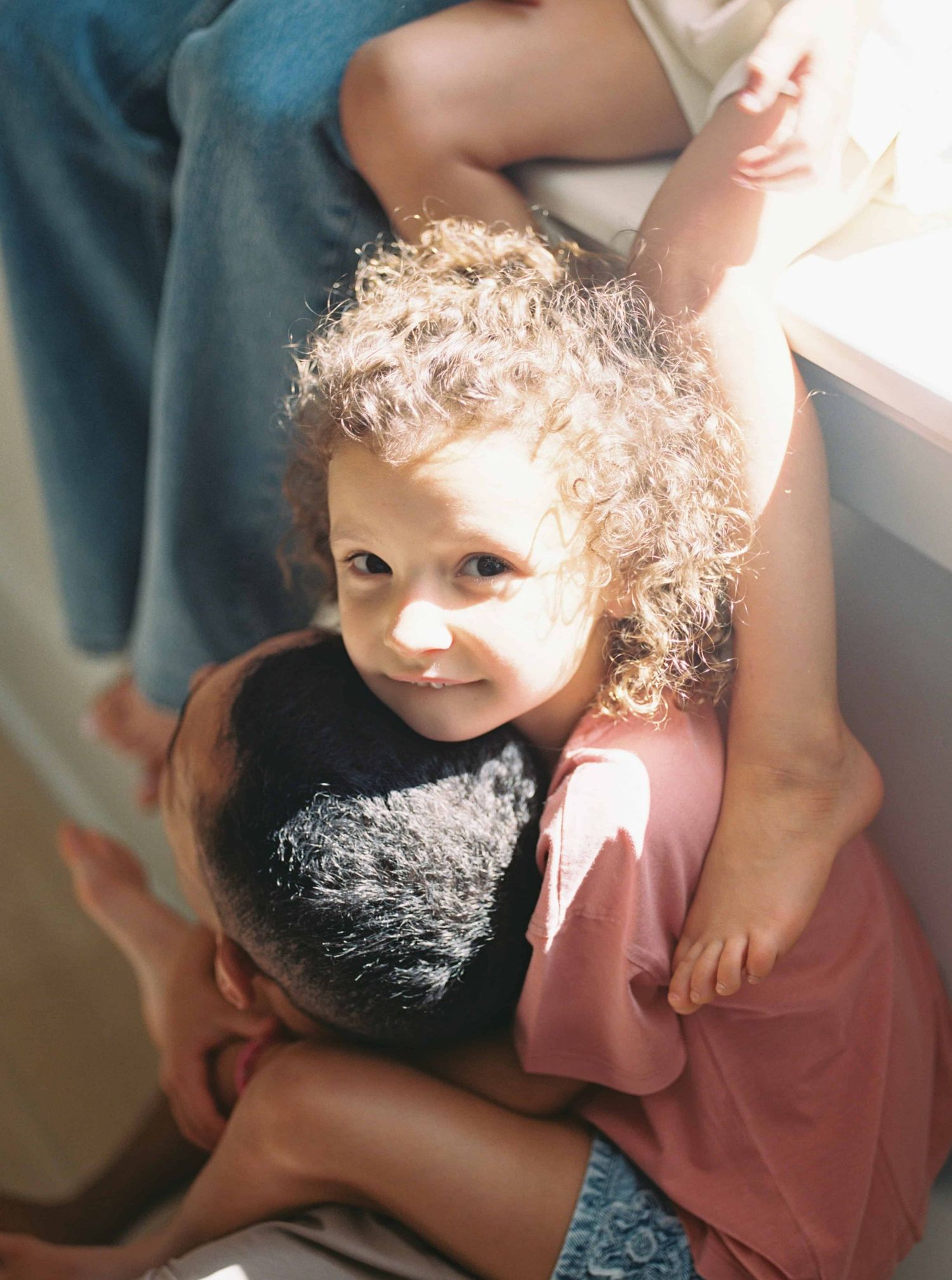 A tender moment showing affection and connection between two people in soft lighting.