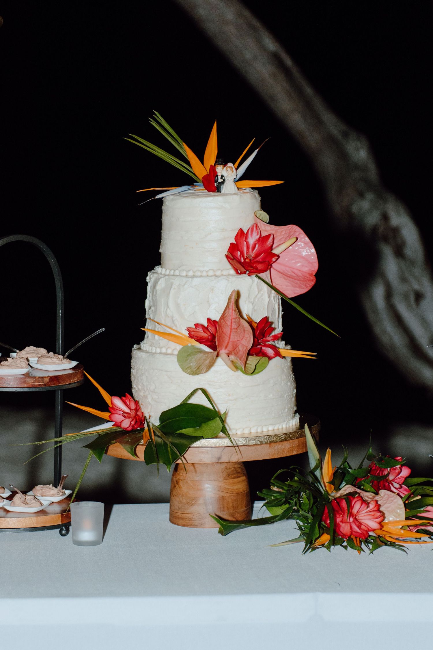 Hawaiian wedding cake inspo Honolulu wedding photographer, documentary style wedding photographer. tropical flower cake inspo. cake topper