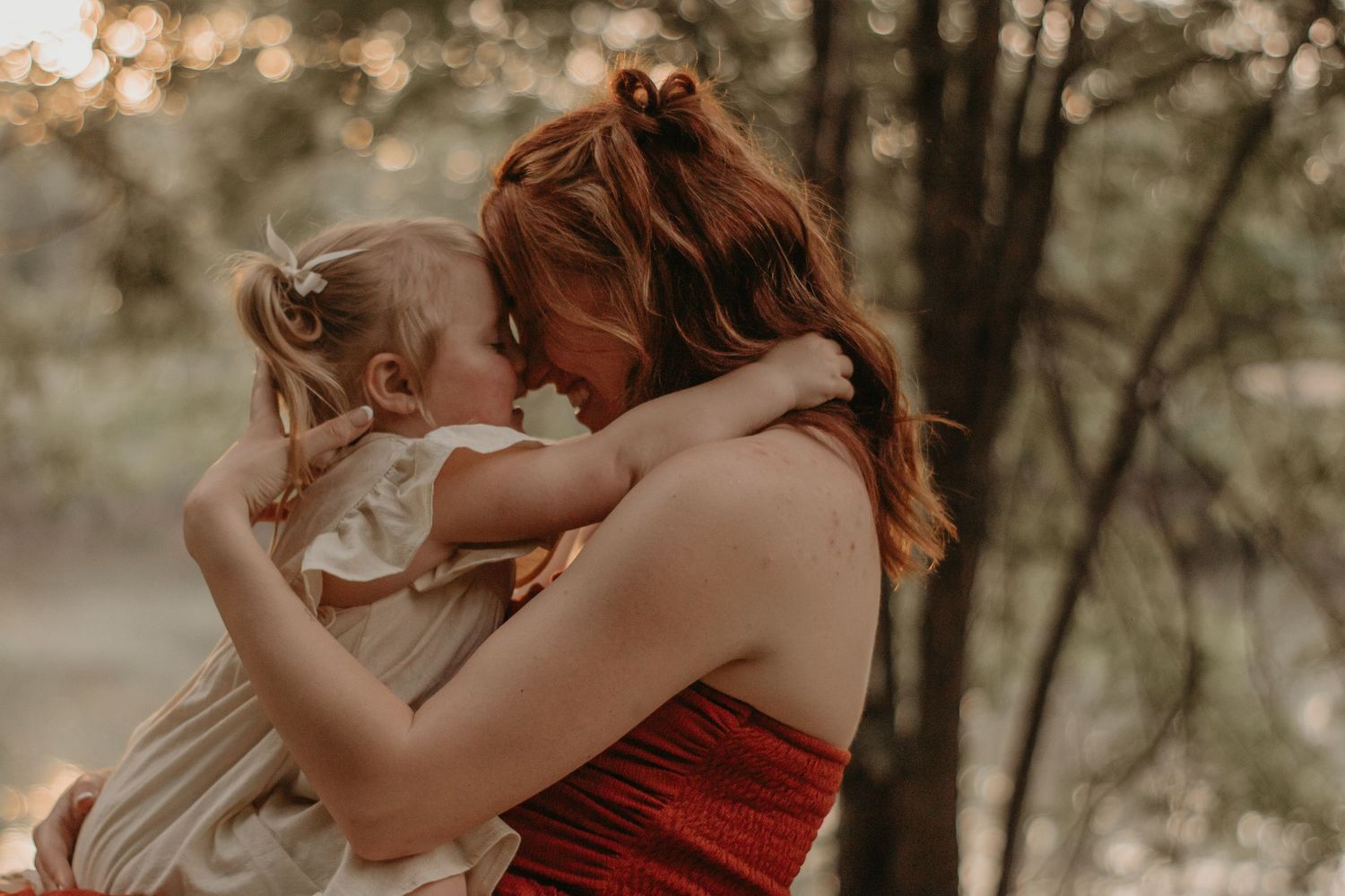 Mother hugging her son tightly during a heartfelt outdoor family photography session in Northwest Indiana