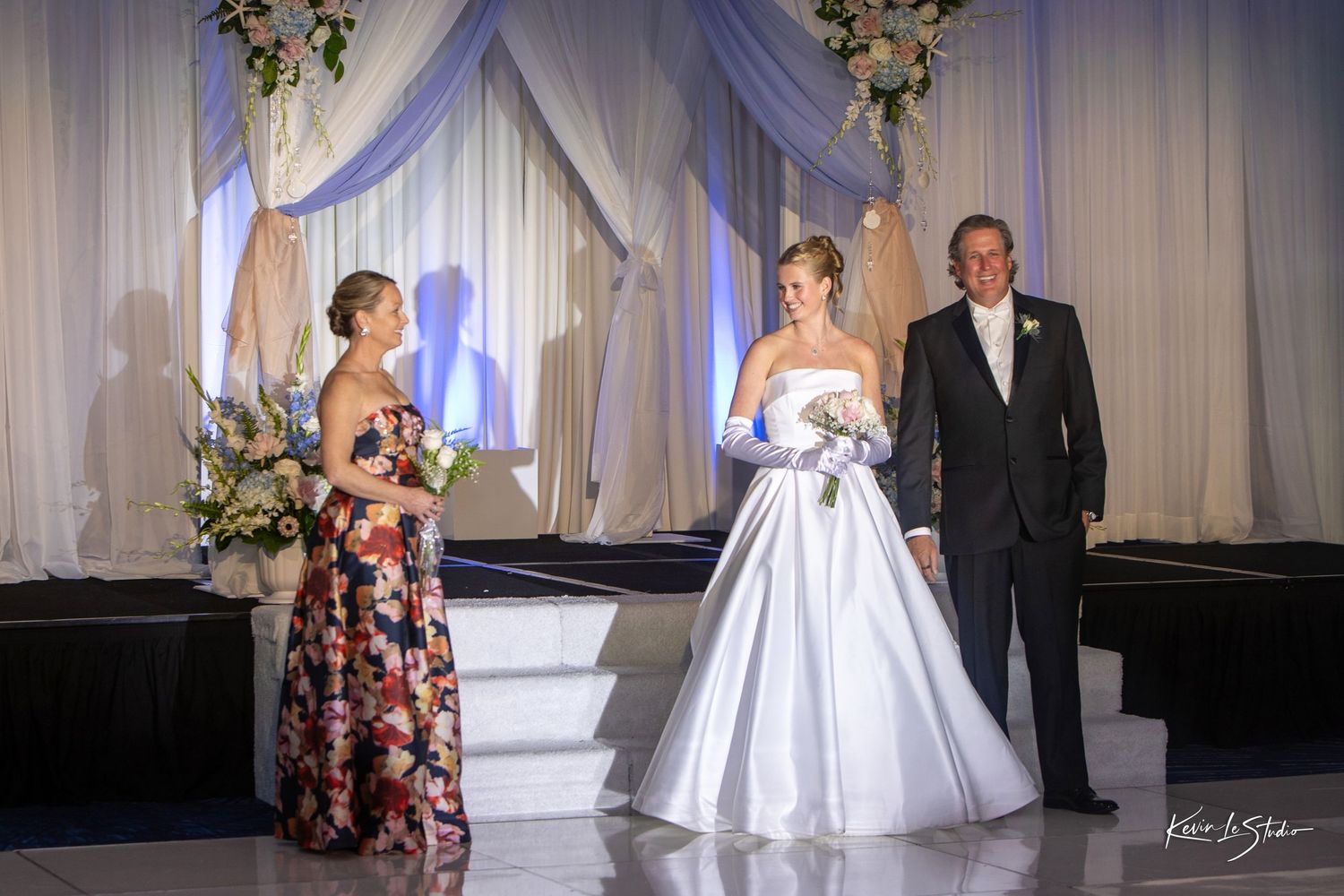 A sequence of elegant wedding ceremony moments captured in a ballroom with white drapes and floral decorations.