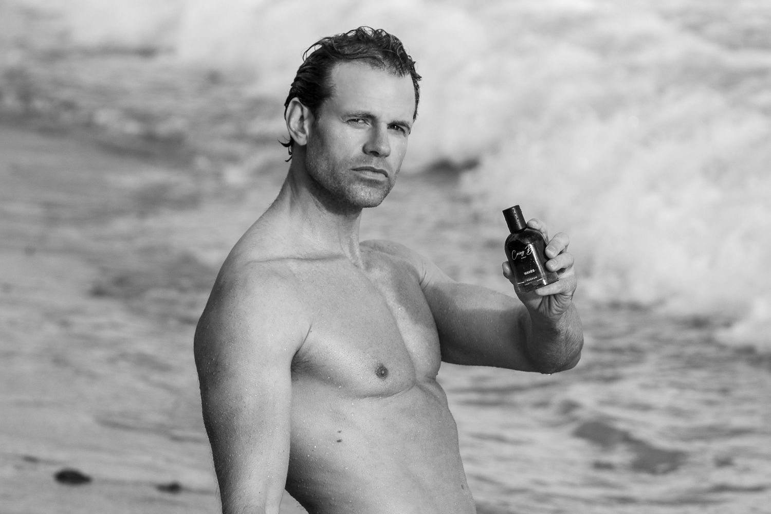A black and white photo sequence showing someone emerging from water at a beach.