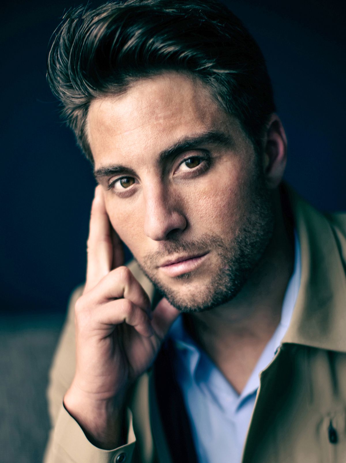 Artistic portrait series showing contemplative poses against dark background in dramatic lighting.