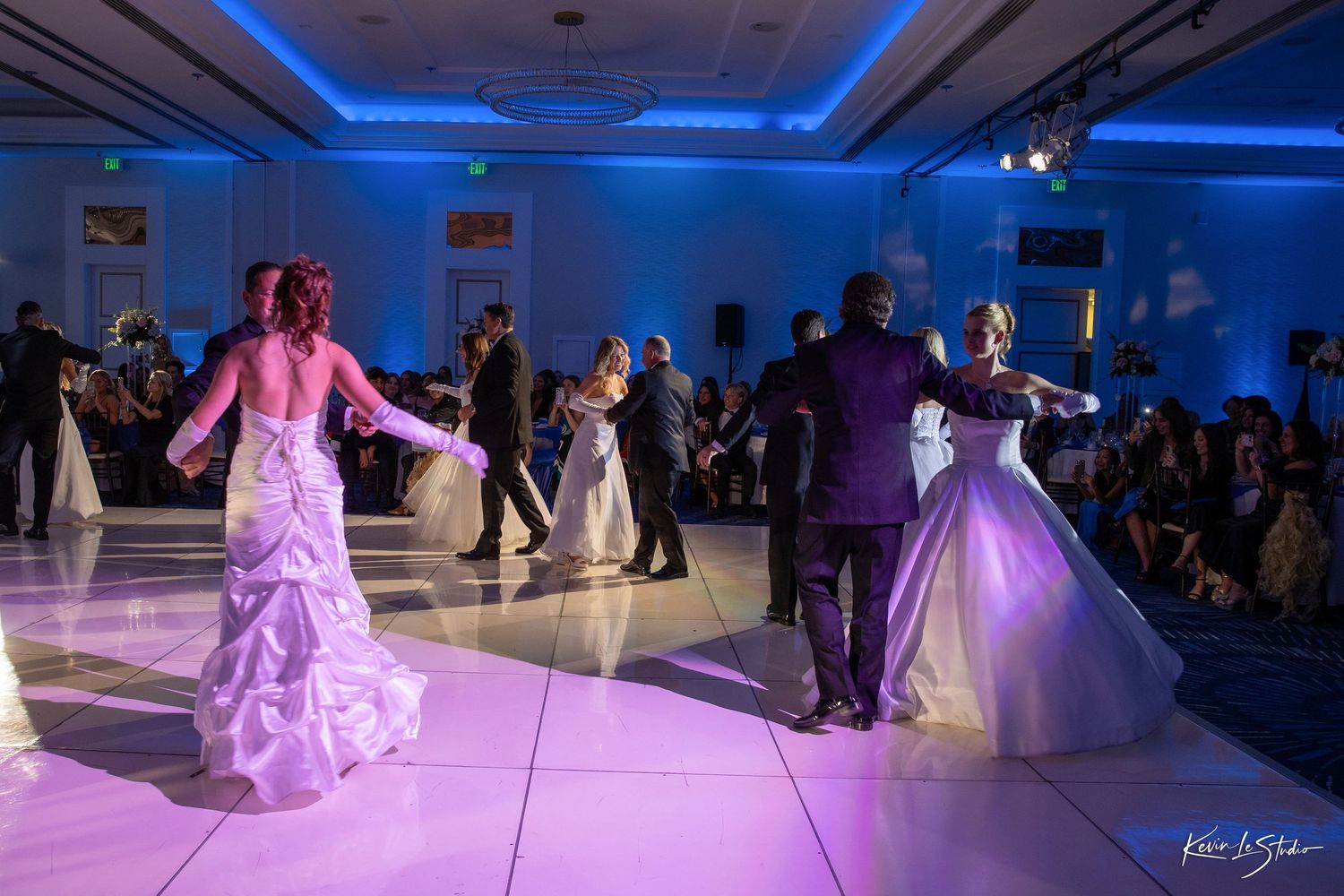 A series of wedding reception photos showing couples dancing under blue uplighting and a bride in a pink-lit dress on the dancefloor.