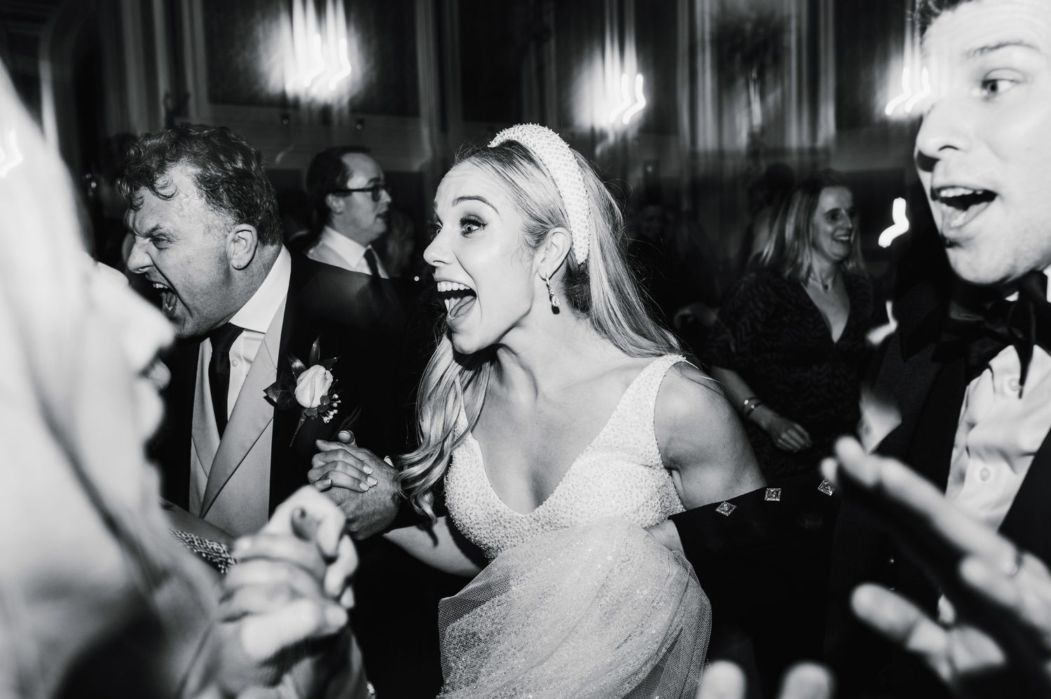 Aberdeen Wedding Photography. Black and white candid shots of wedding reception guests dancing and celebrating.