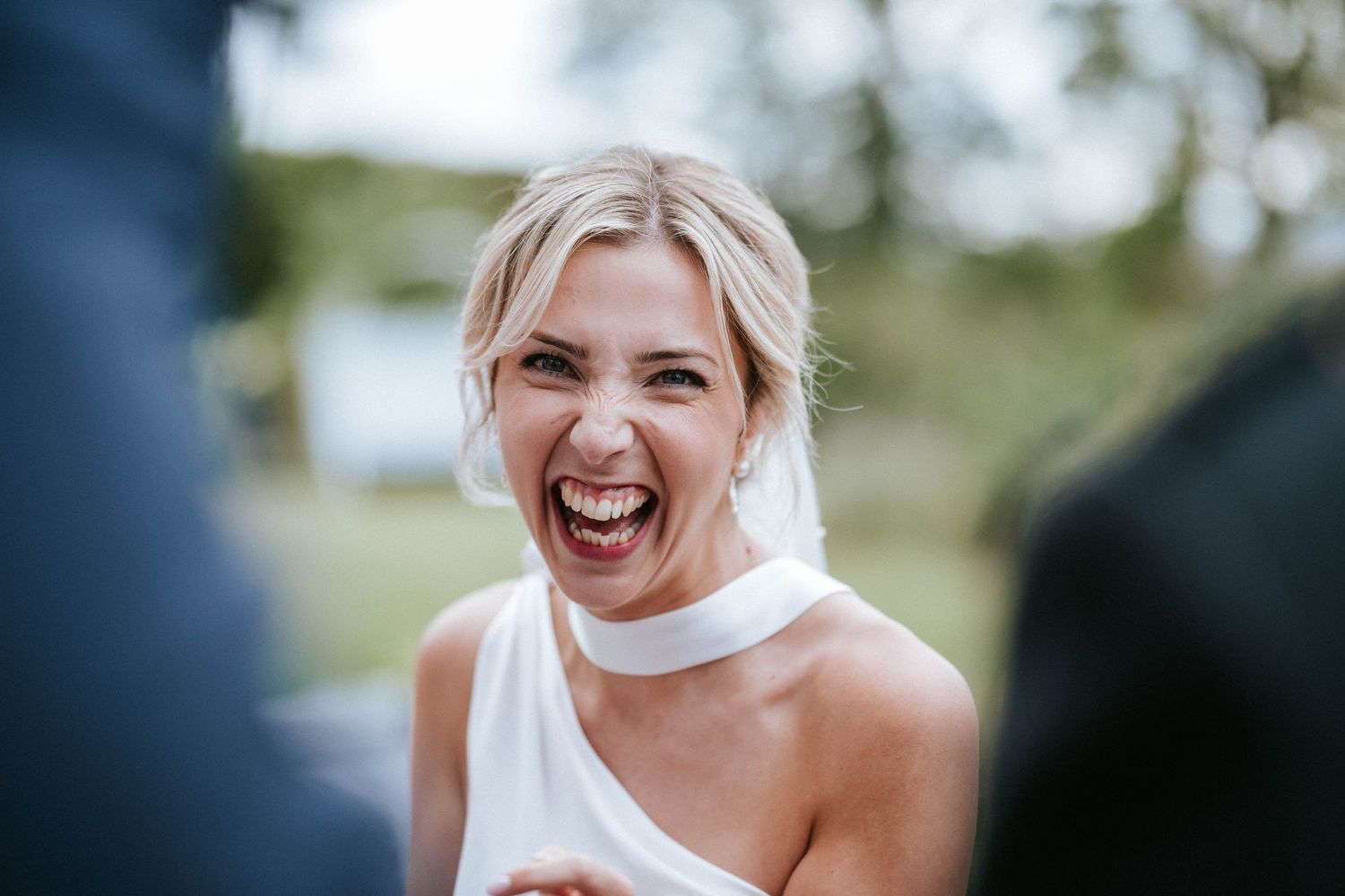 Joyful moments captured during an outdoor wedding celebration.