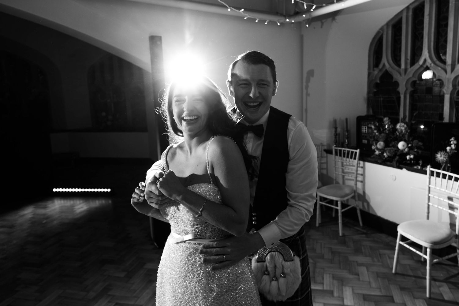 Romantic dance moments captured at a wedding reception with ambient lighting.