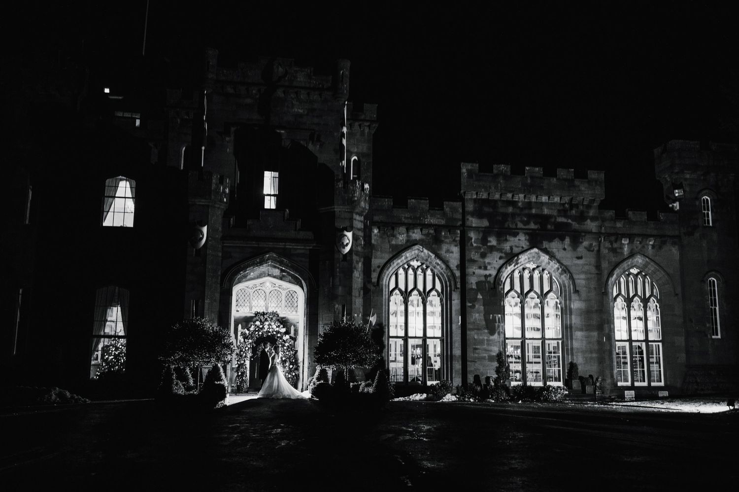 Aberdeen Wedding Photography. Gothic church architecture illuminated at night with arched windows and stone details.