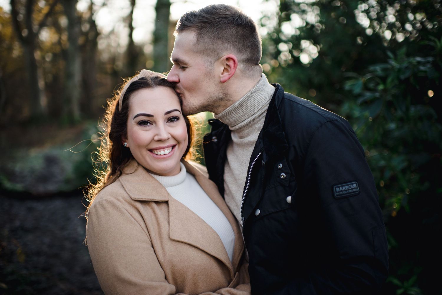 A sweet moment between a couple during their winter engagement photoshoot.