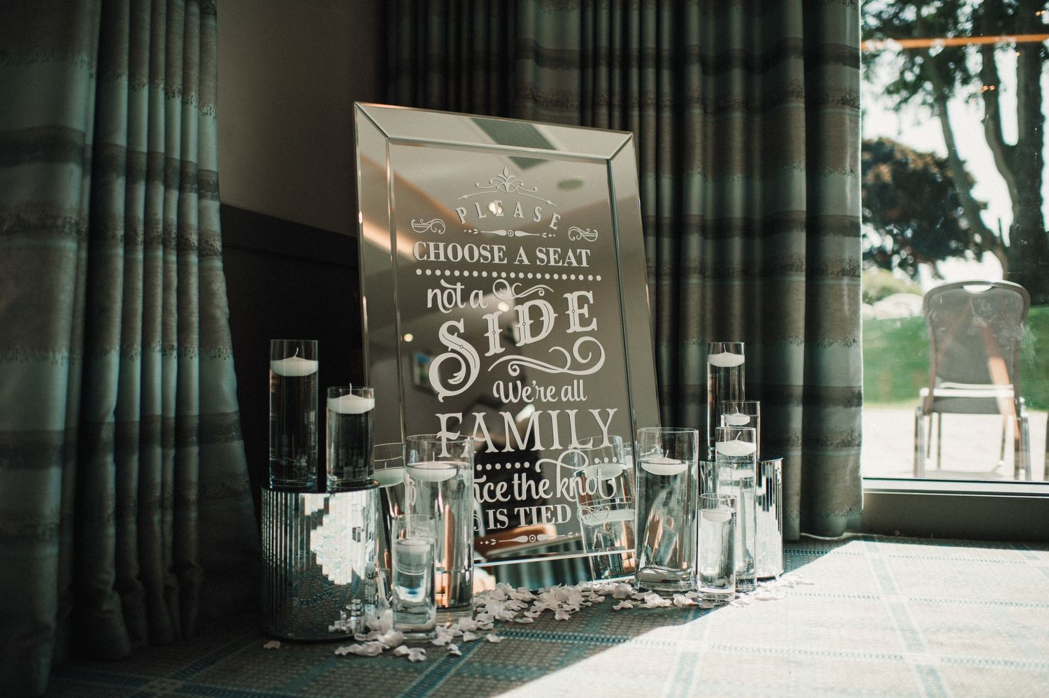 Wedding welcome sign with glassware setup for a Joe family celebration.