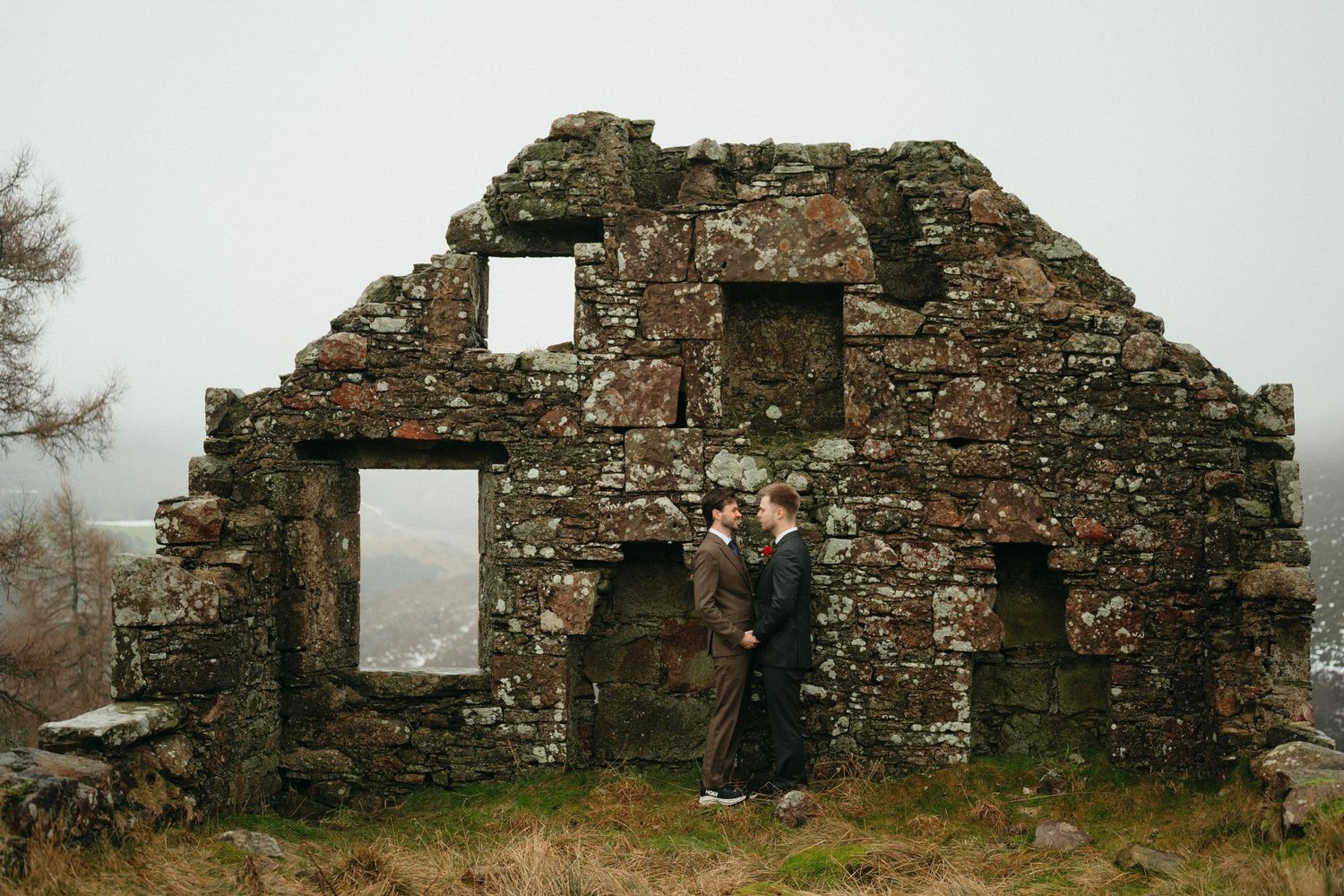 Drumtochty Castle  Wedding Photography. Ancient stone ruins stand against a misty backdrop during a winter wedding photoshoot.