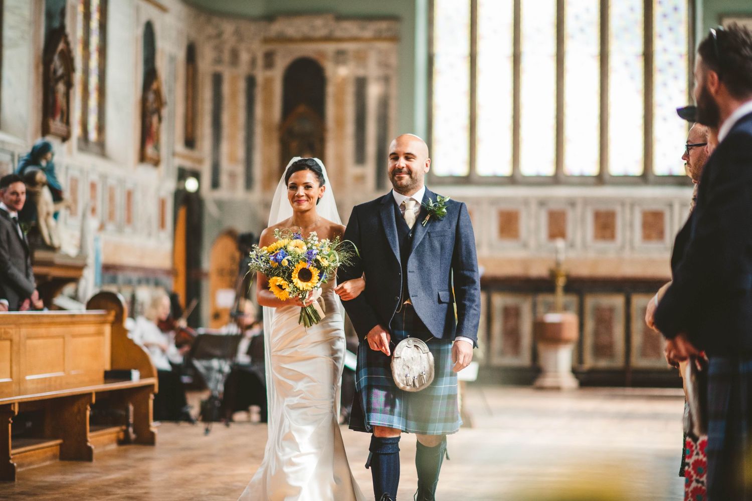A traditional Scottish wedding ceremony taking place inside a historic church.