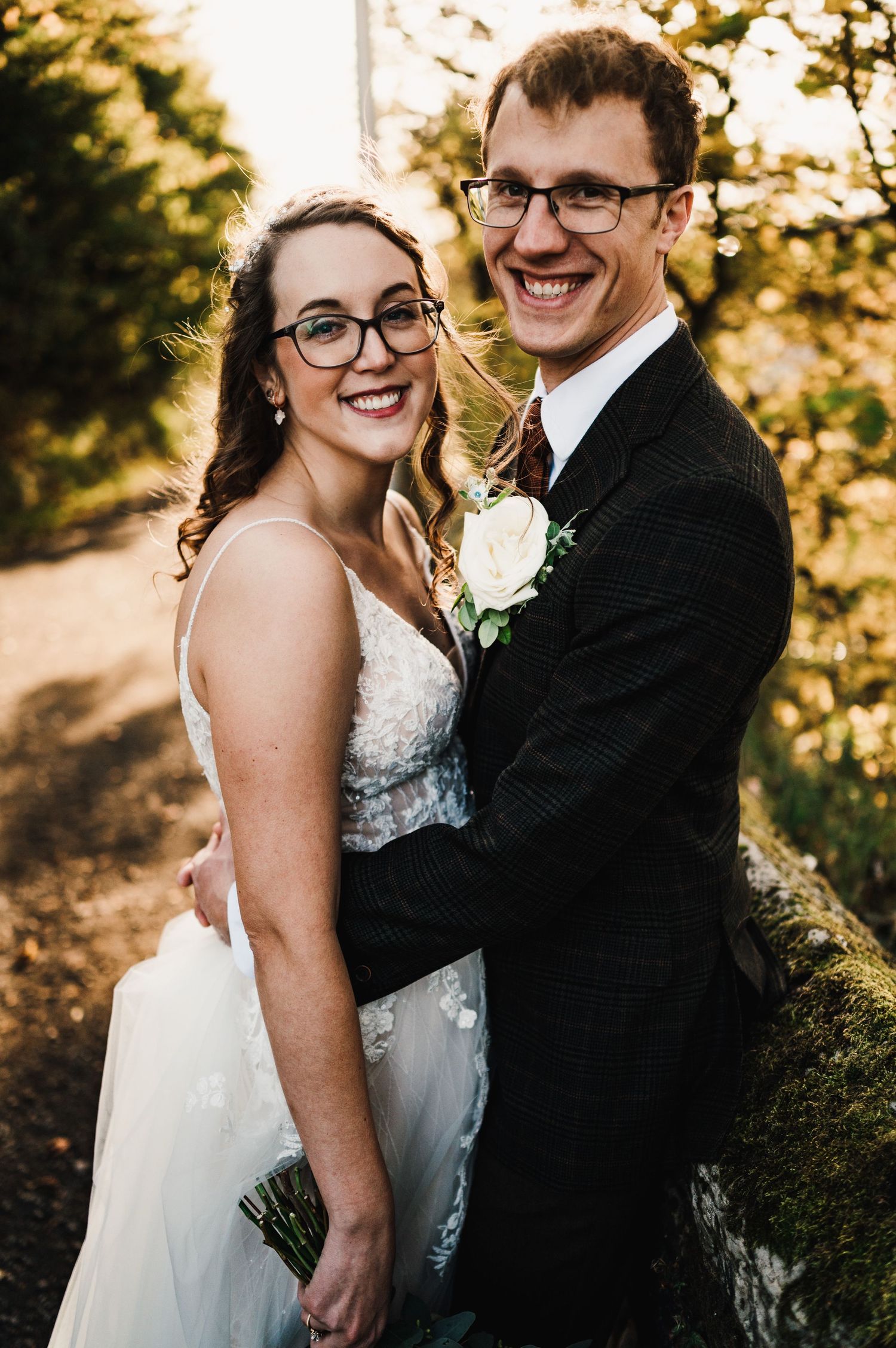 Aberdeen Wedding Photography. A romantic wedding couple shares an intimate moment at golden hour in a garden setting.