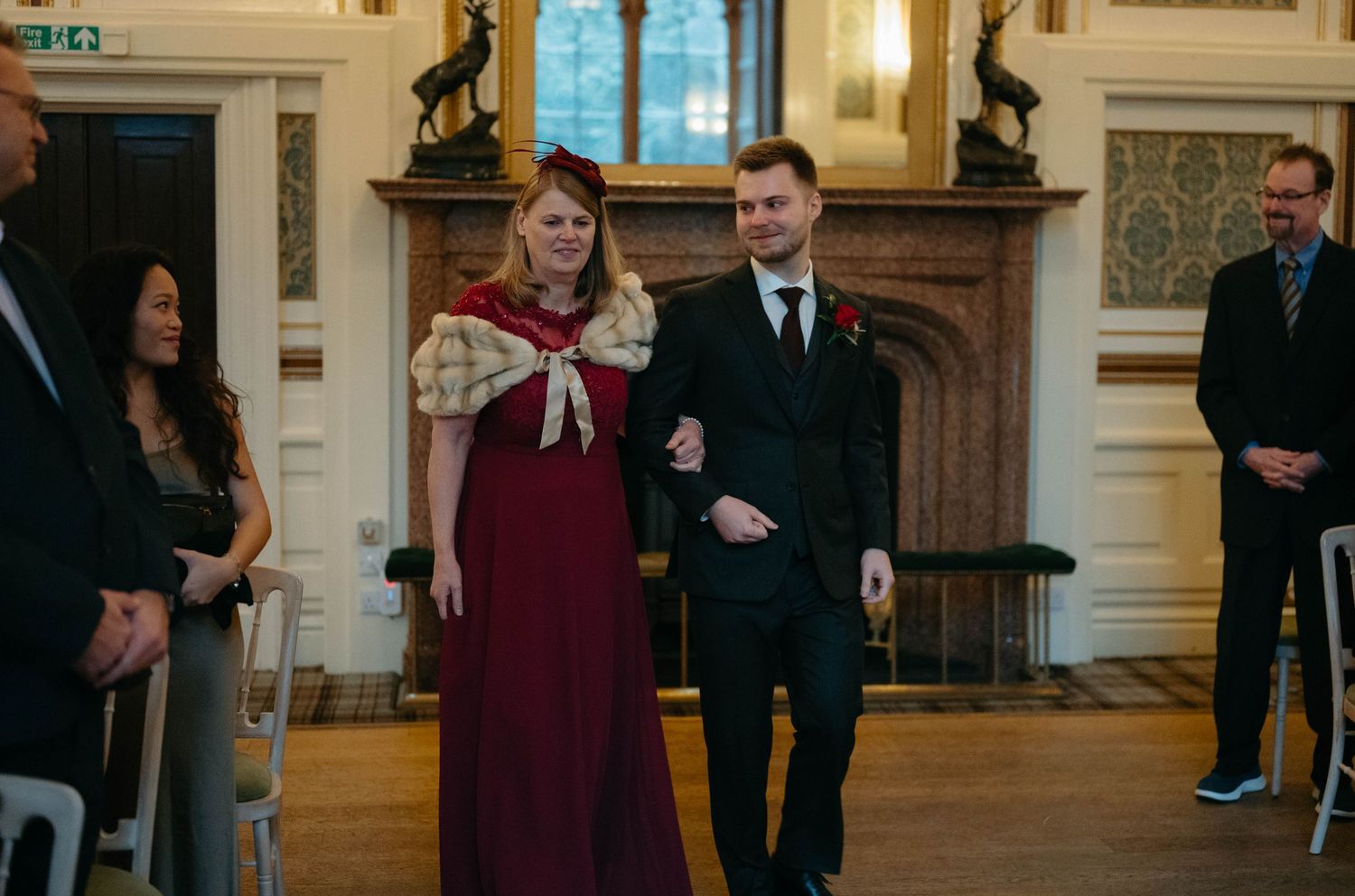 Drumtochty Castle  Wedding Photography. Wedding guests dancing and celebrating in an elegant ballroom with ornate details.
