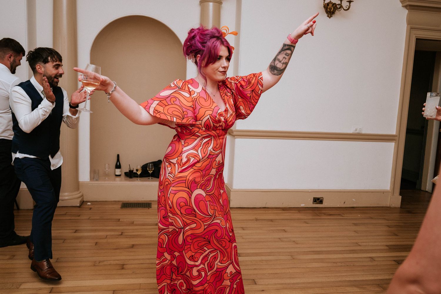 Aberdeen Wedding Photography. Wedding reception dance party with guests celebrating on wooden dance floor.