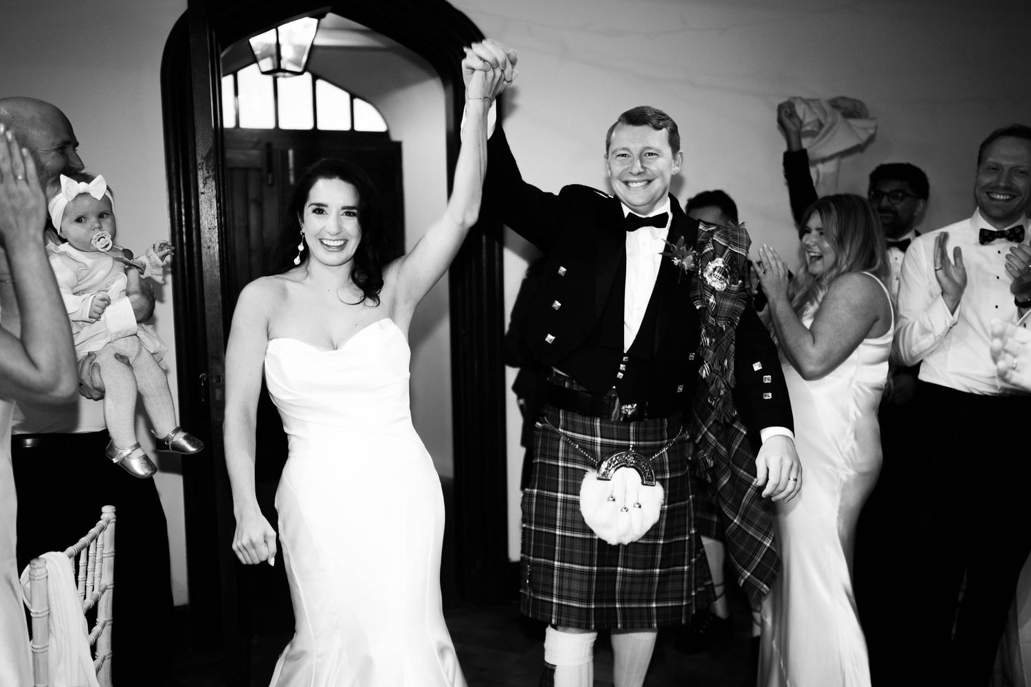 Black and white candid wedding reception photos showing dancing and celebration.