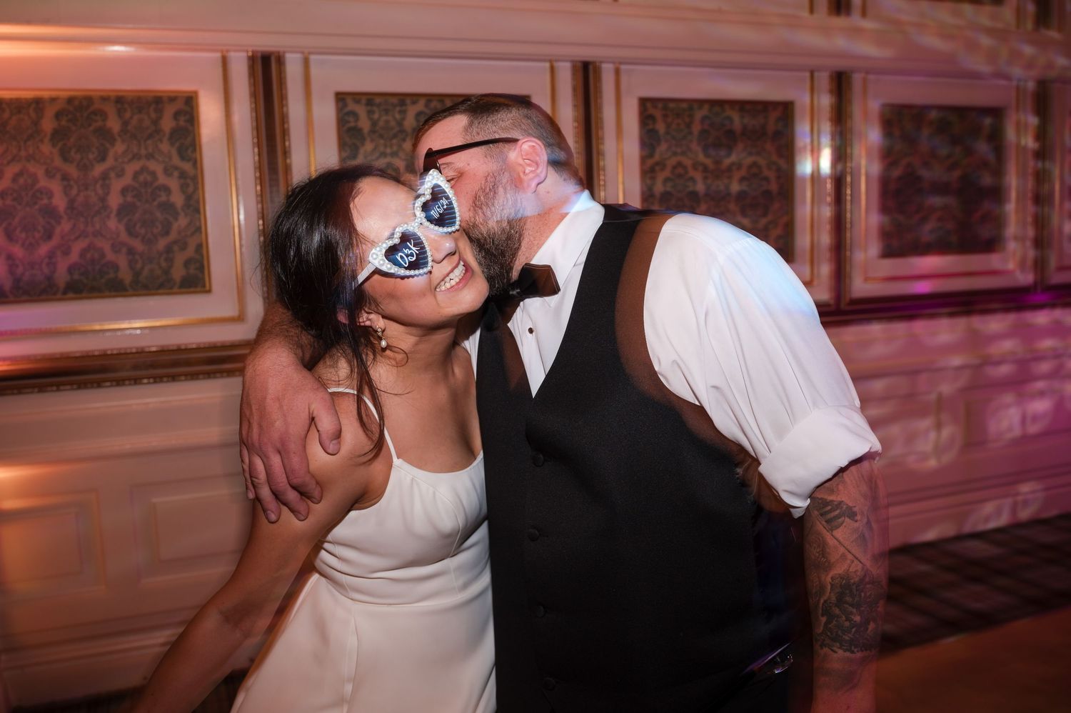 Aberdeen Wedding Photography. Wedding reception guests dance and celebrate with fun party accessories.