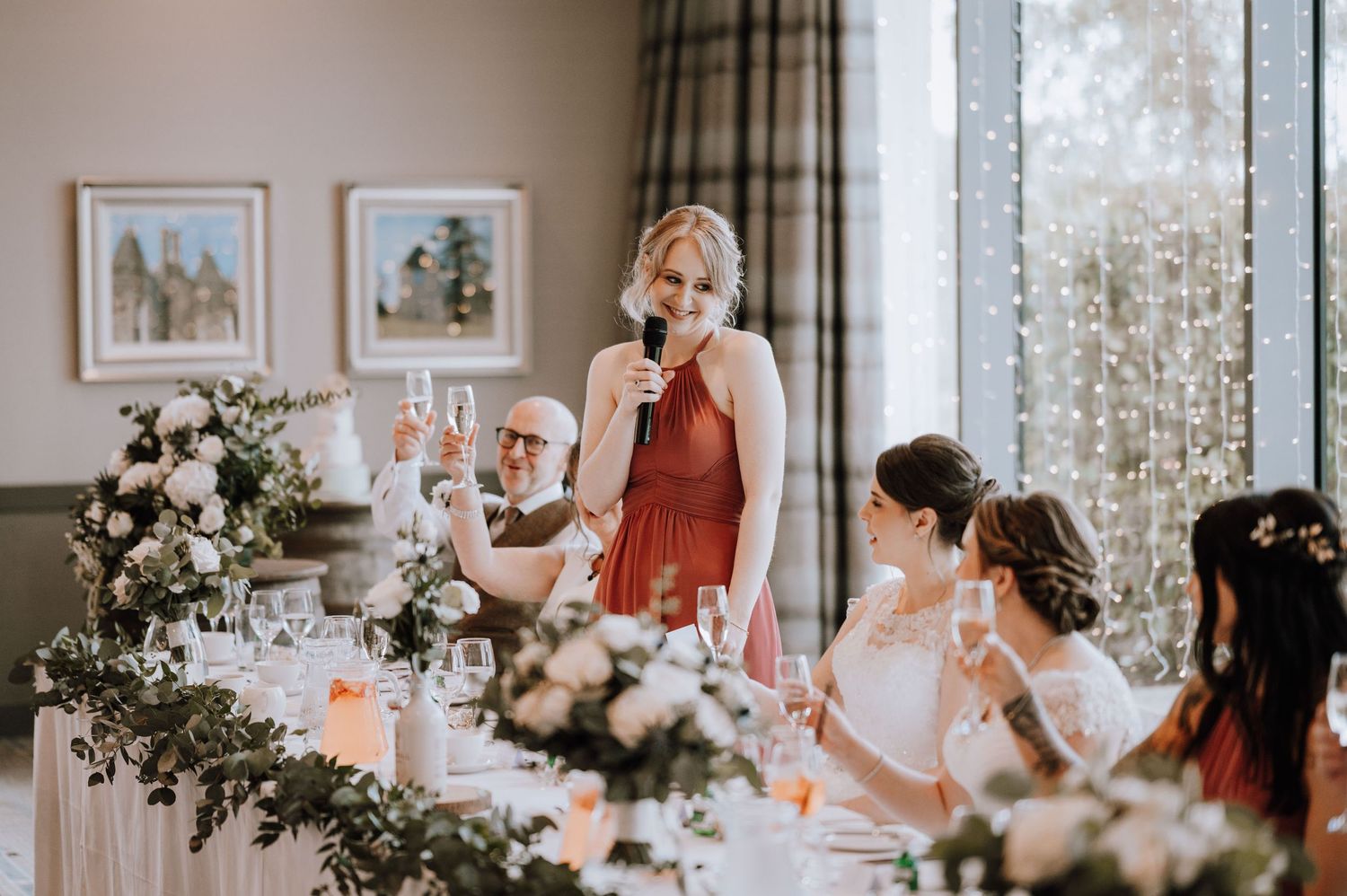 Aberdeen Wedding Photography. Wedding reception table decorated with elegant floral centerpieces and candlelight.