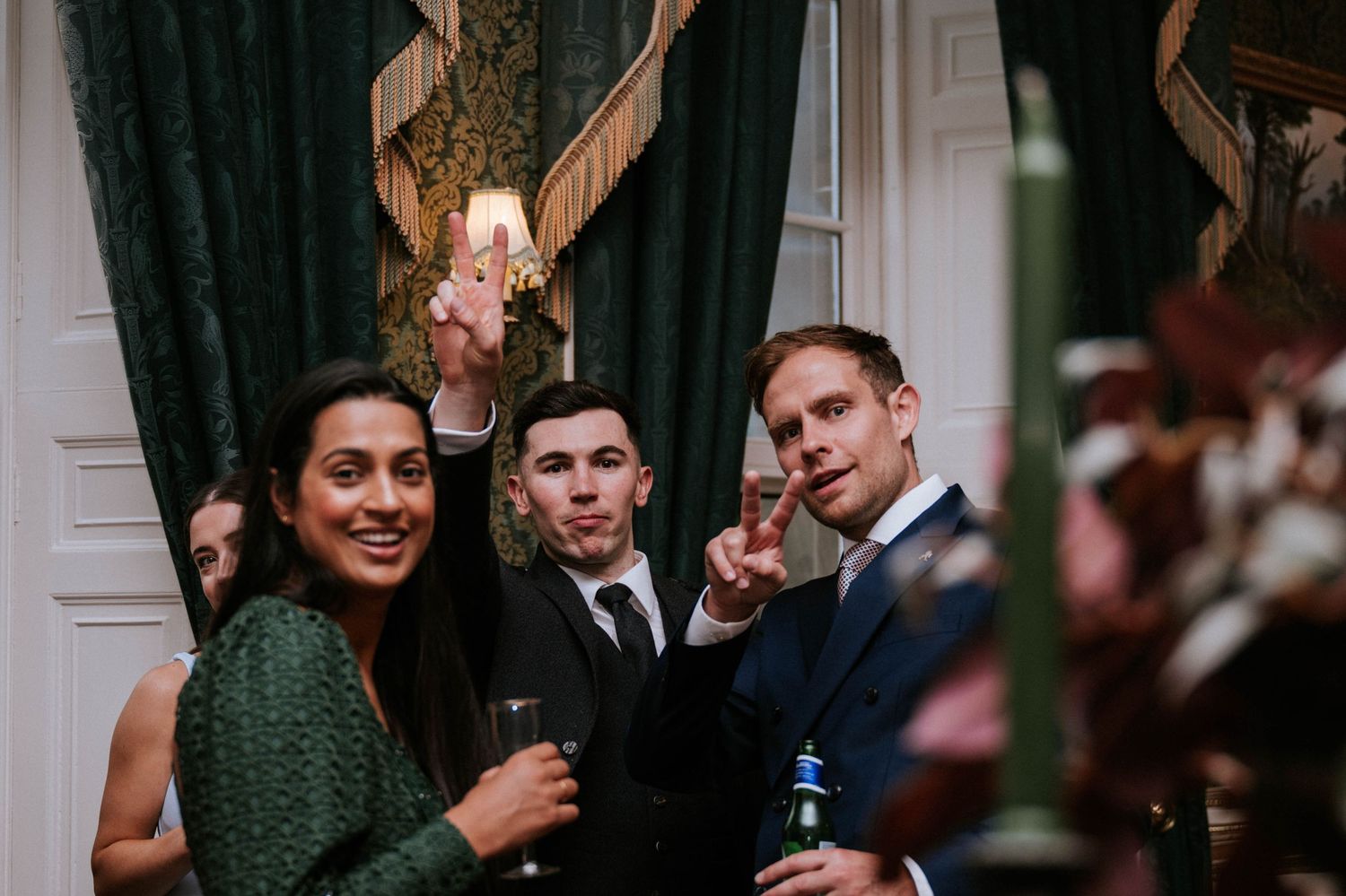 Wedding reception guests celebrate with dancing and laughter.