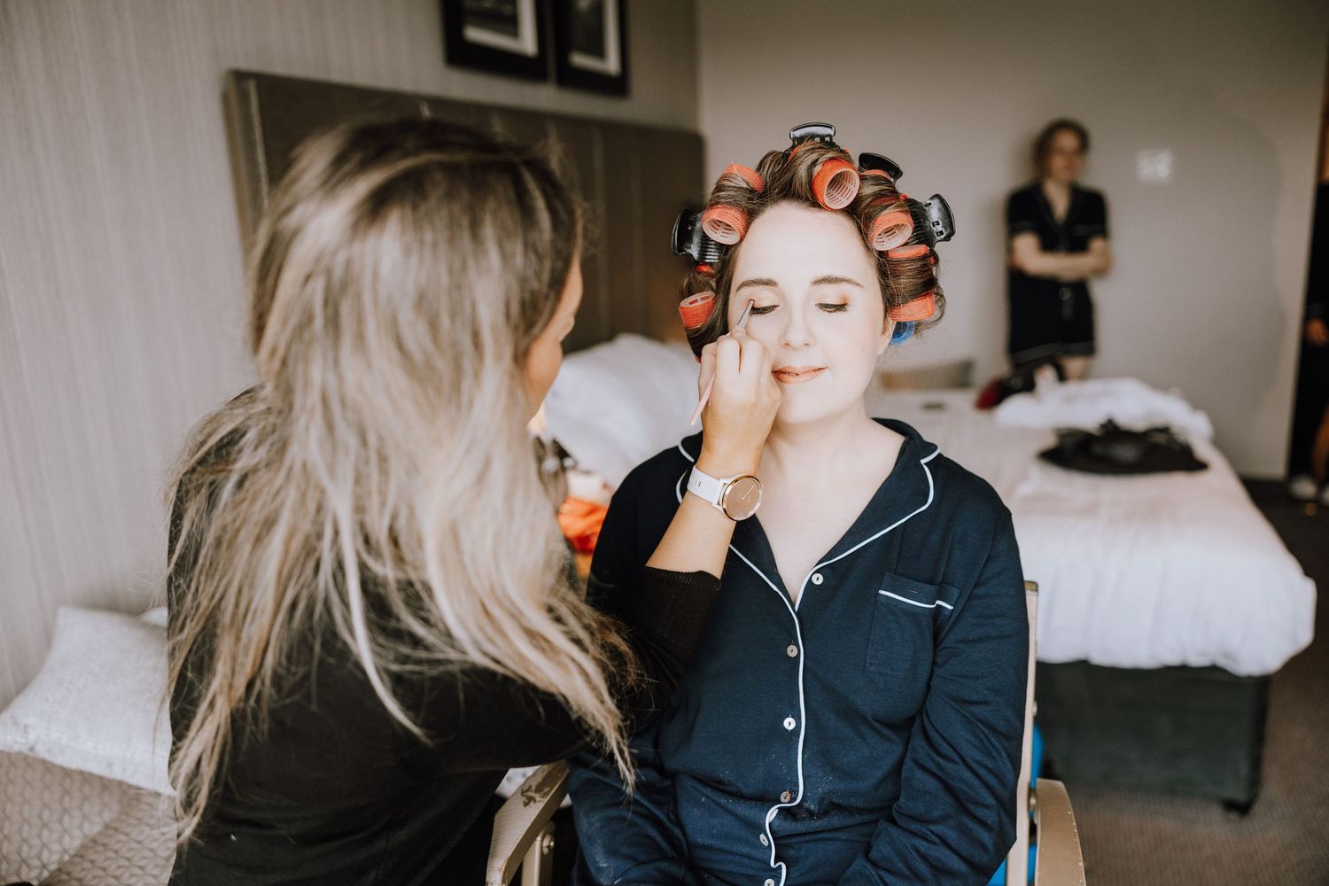 Meldrum House Wedding Photography. A group getting ready in matching robes during wedding day preparations.