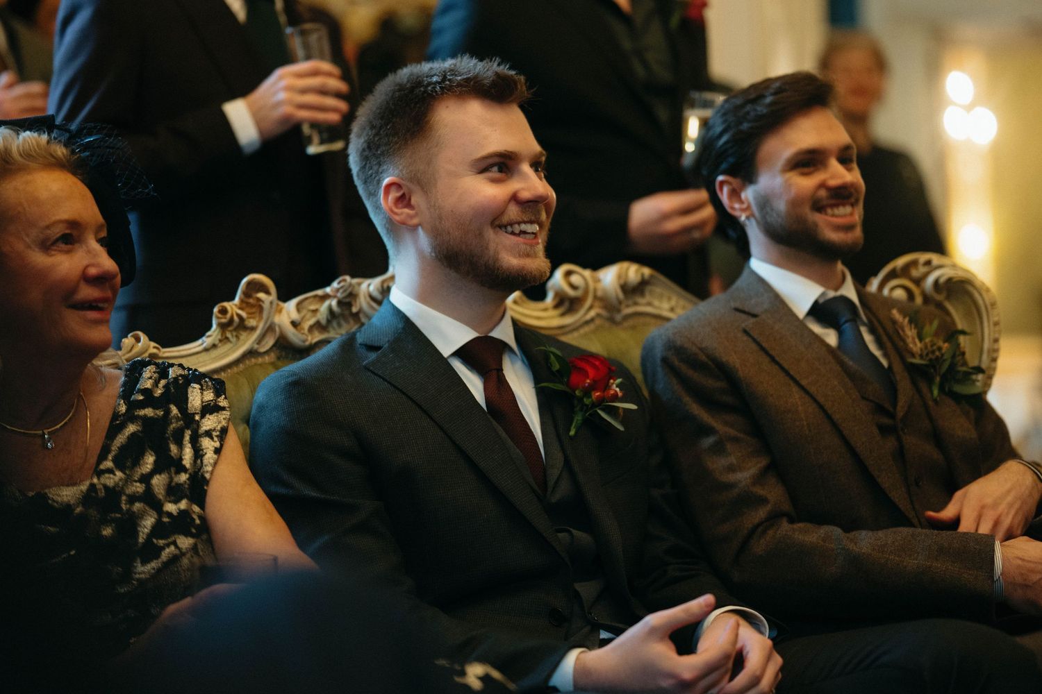 Drumtochty Castle  Wedding Photography. Guests enjoying a formal celebration while seated in ornate chairs.