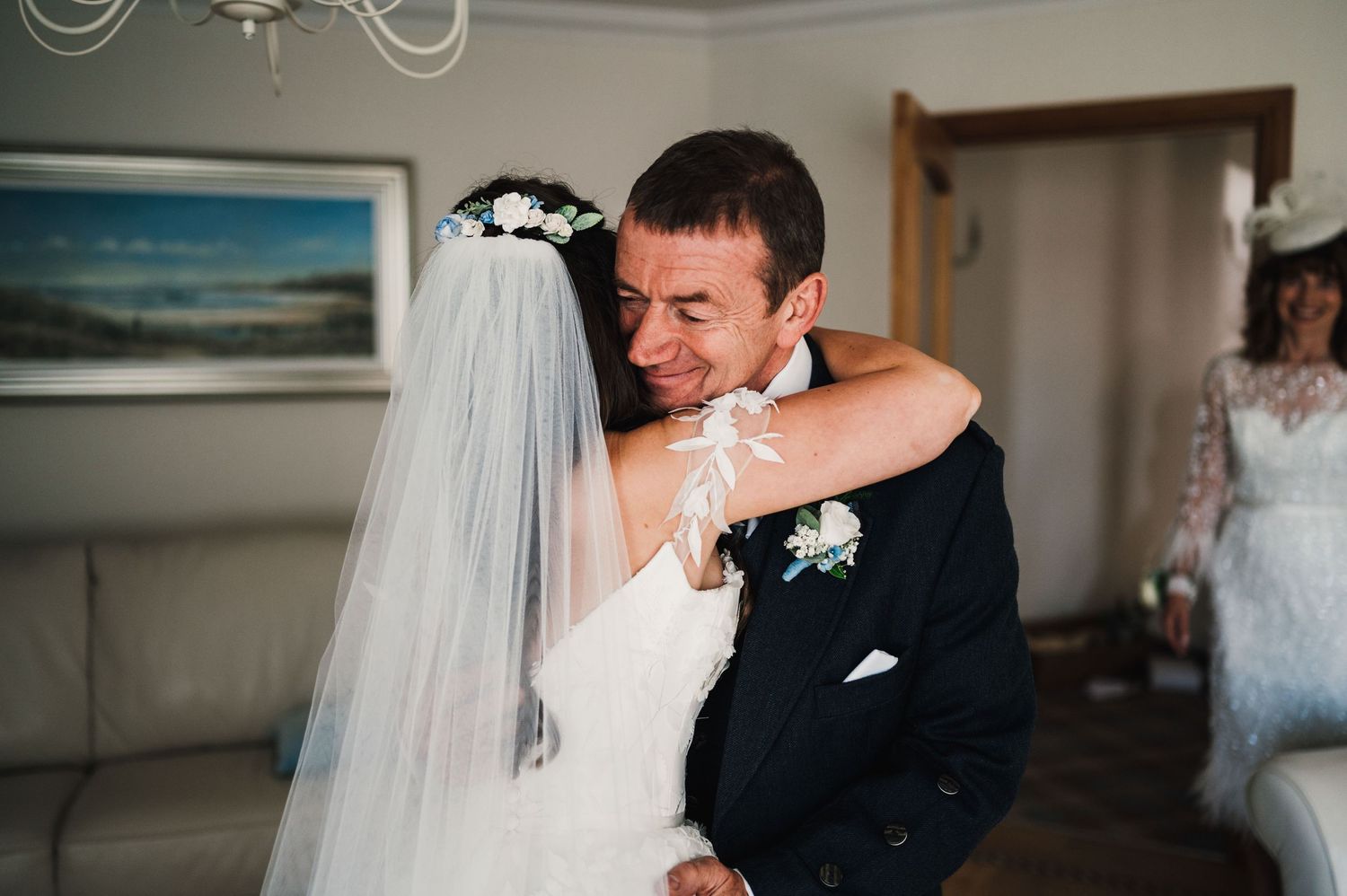 A tender moment captured during a wedding celebration indoors.
