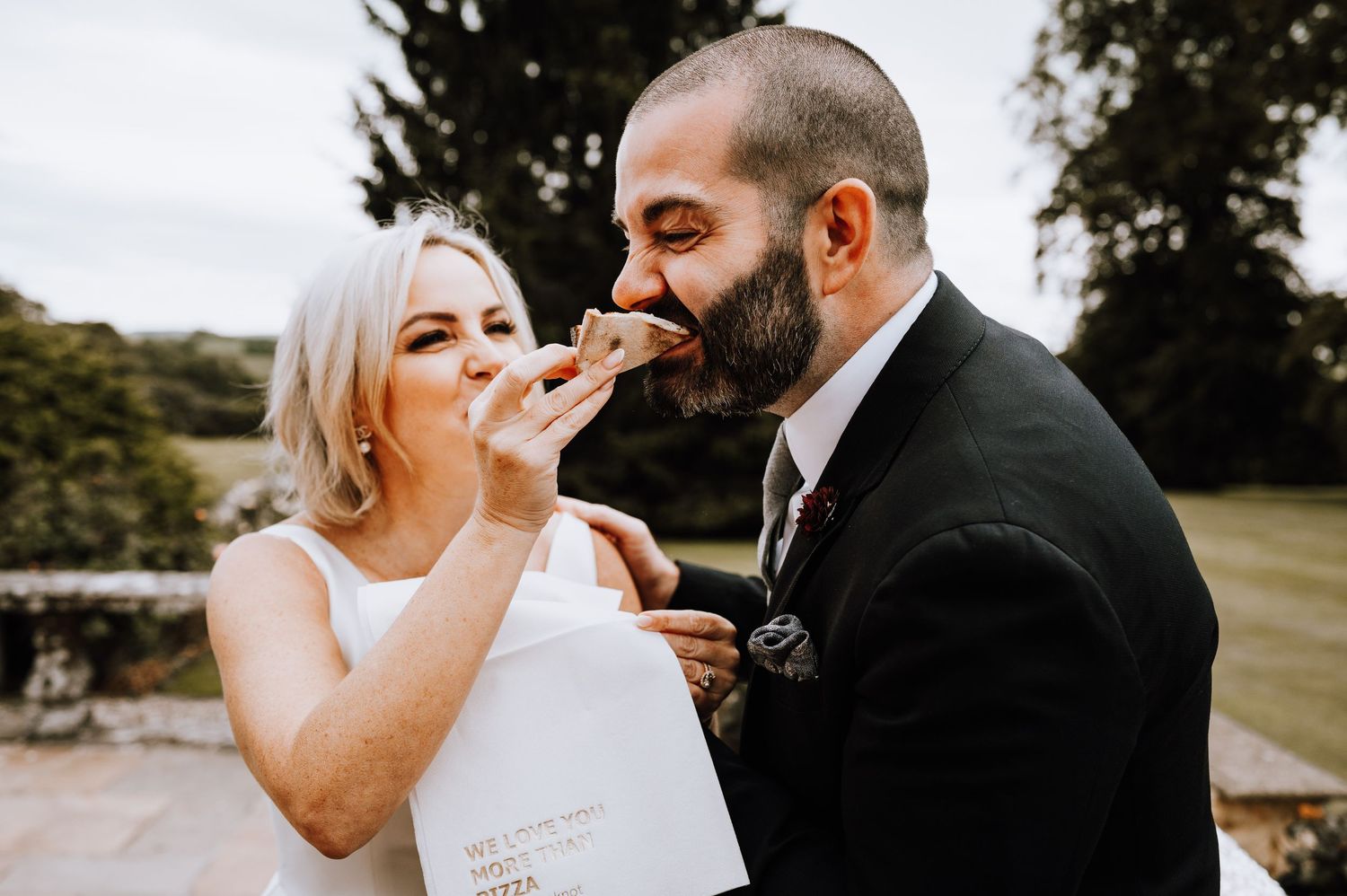Aberdeen Wedding Photography. Emotional wedding couple embraces during first look in outdoor garden setting.