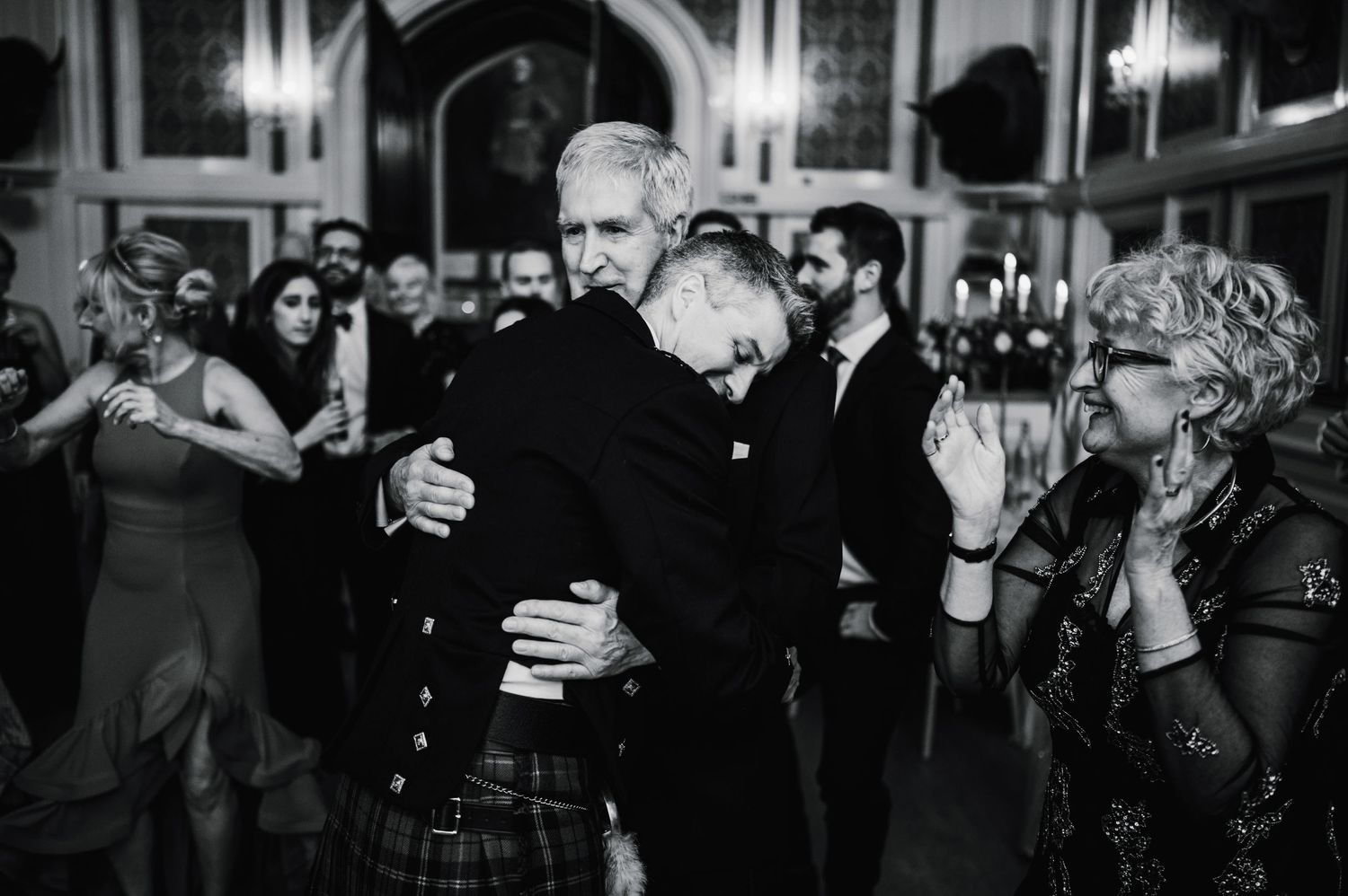 Traditional Scottish wedding celebration with kilted dancers enjoying the festivities.