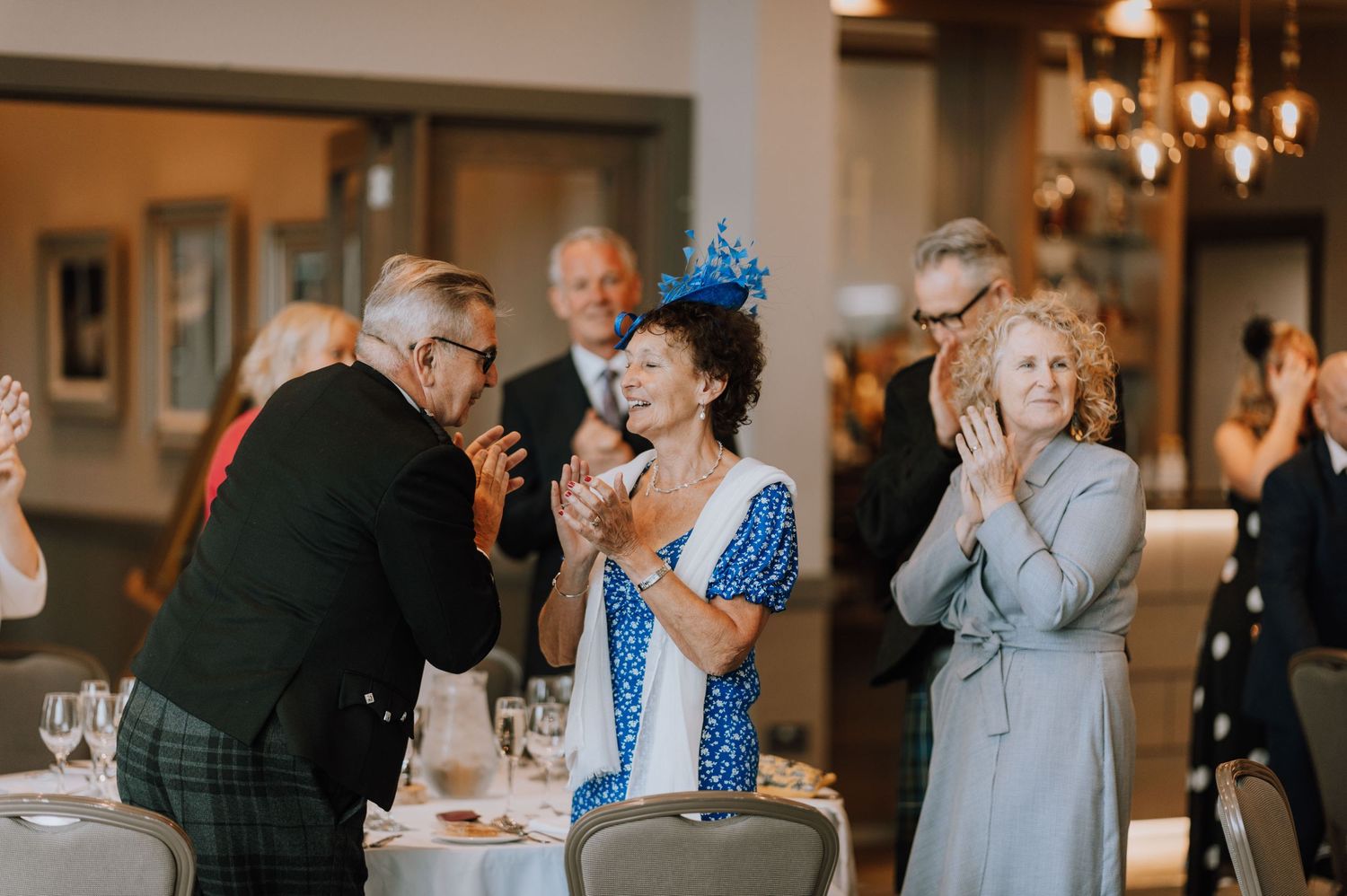 Wedding guests sharing an intimate moment during the reception celebrations.