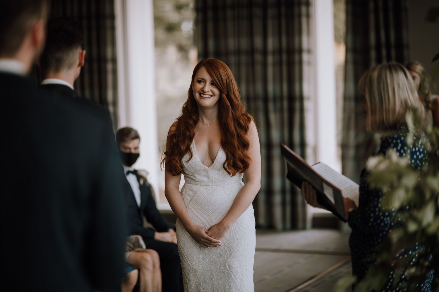 An intimate wedding ceremony moment captured in a modern indoor venue.