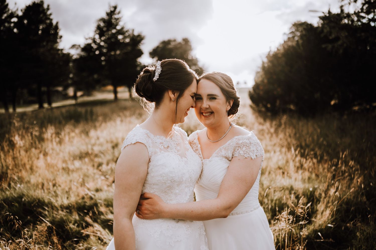 Intimate wedding moment photographed during sunset in a rustic outdoor setting. Meldrum House Wedding Photography.