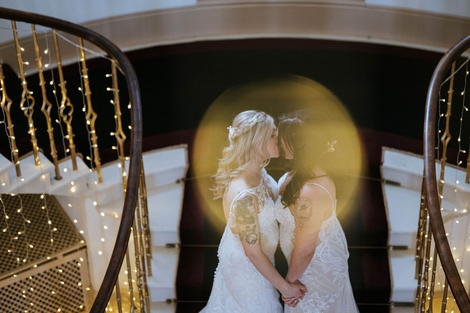 Romantic wedding scene with hanging string lights creating a dreamy atmosphere.