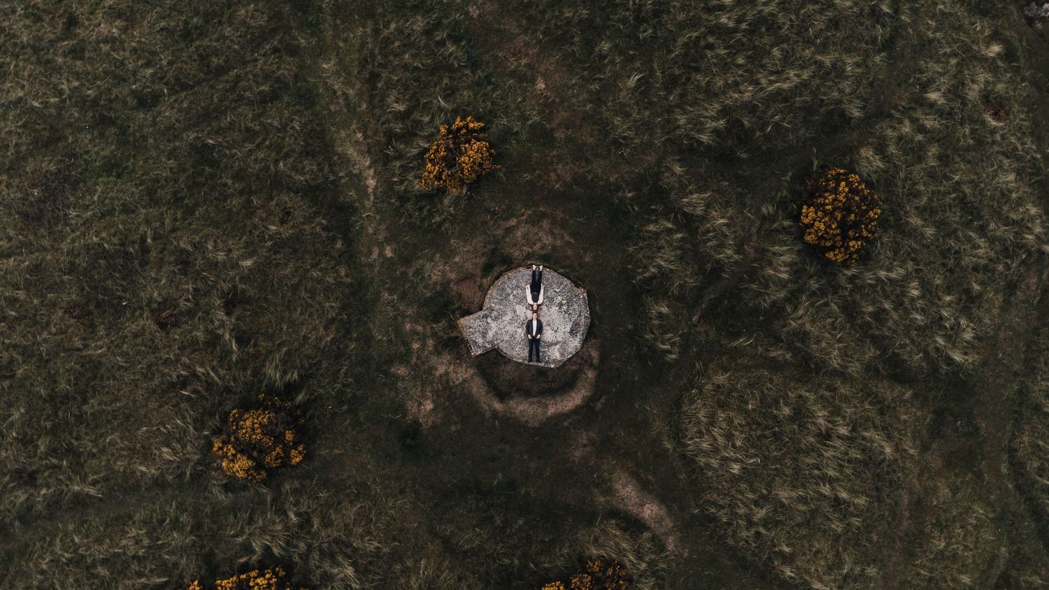 Aerial view of a mysterious circular structure in a rocky landscape.