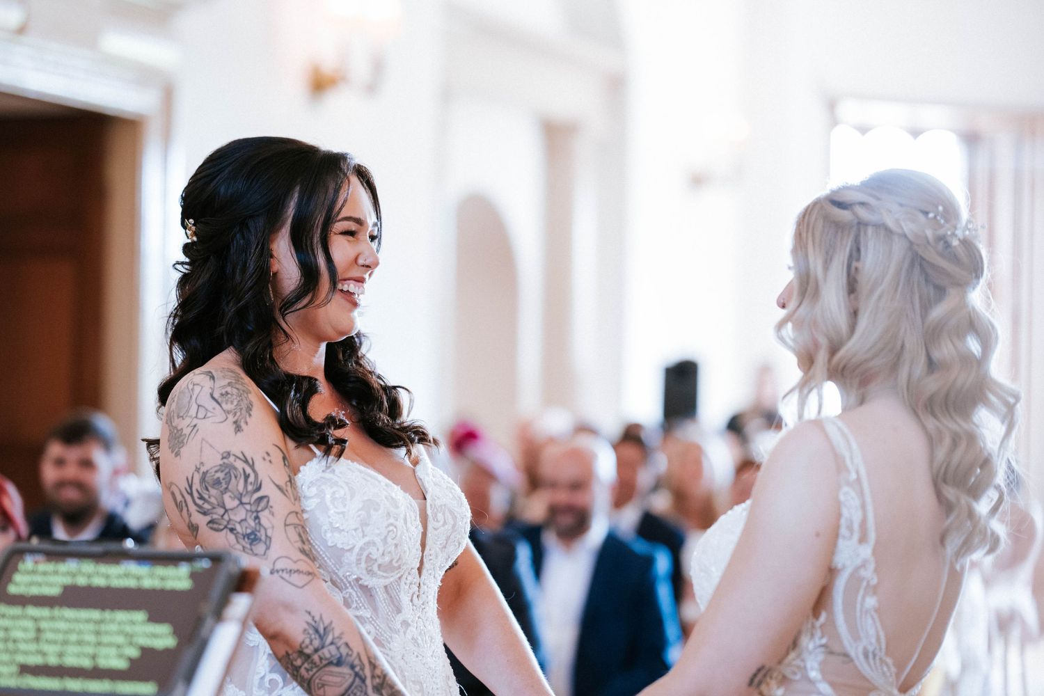 Fasque Castle Wedding Photography. Wedding ceremony candid moments captured in an elegant white venue.
