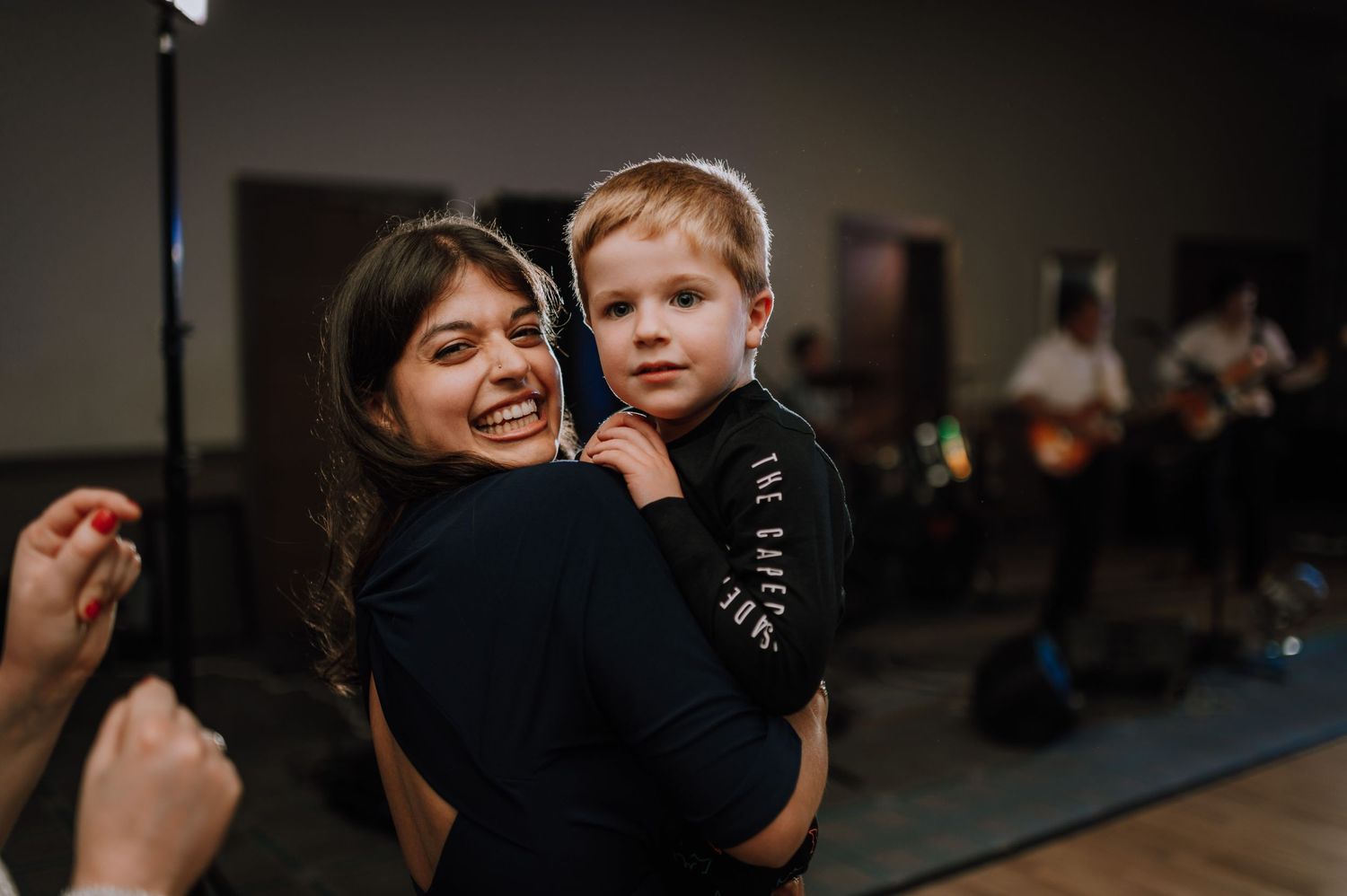 A joyful moment captured between an adult and child during a celebration.