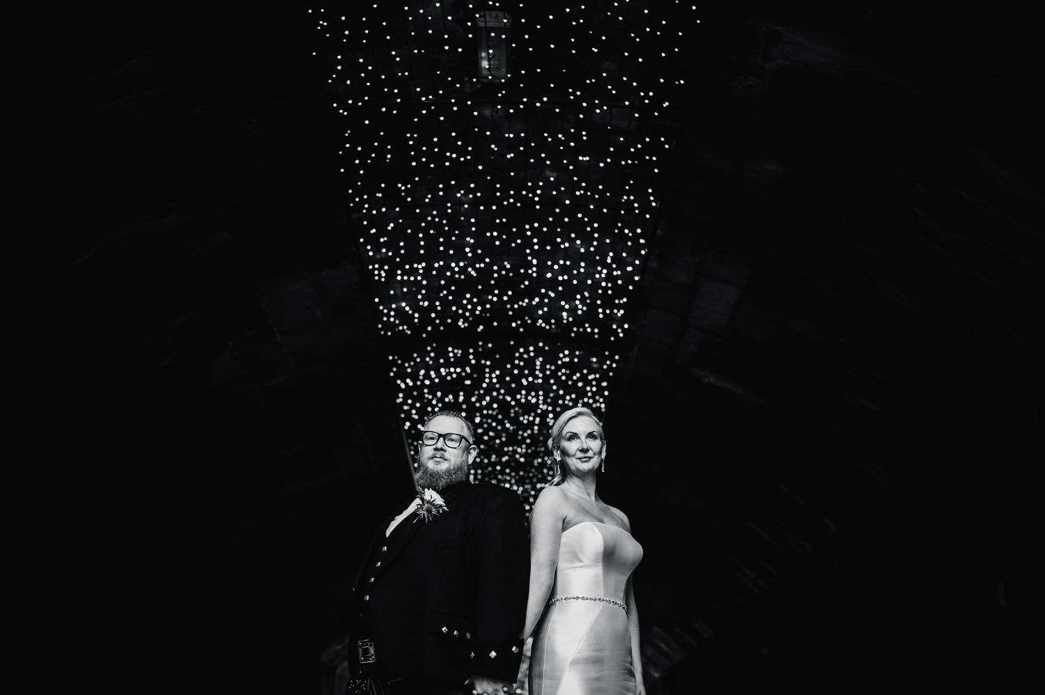 Aberdeen Wedding Photography. Wedding reception scene with twinkling fairy lights creating a magical atmosphere.