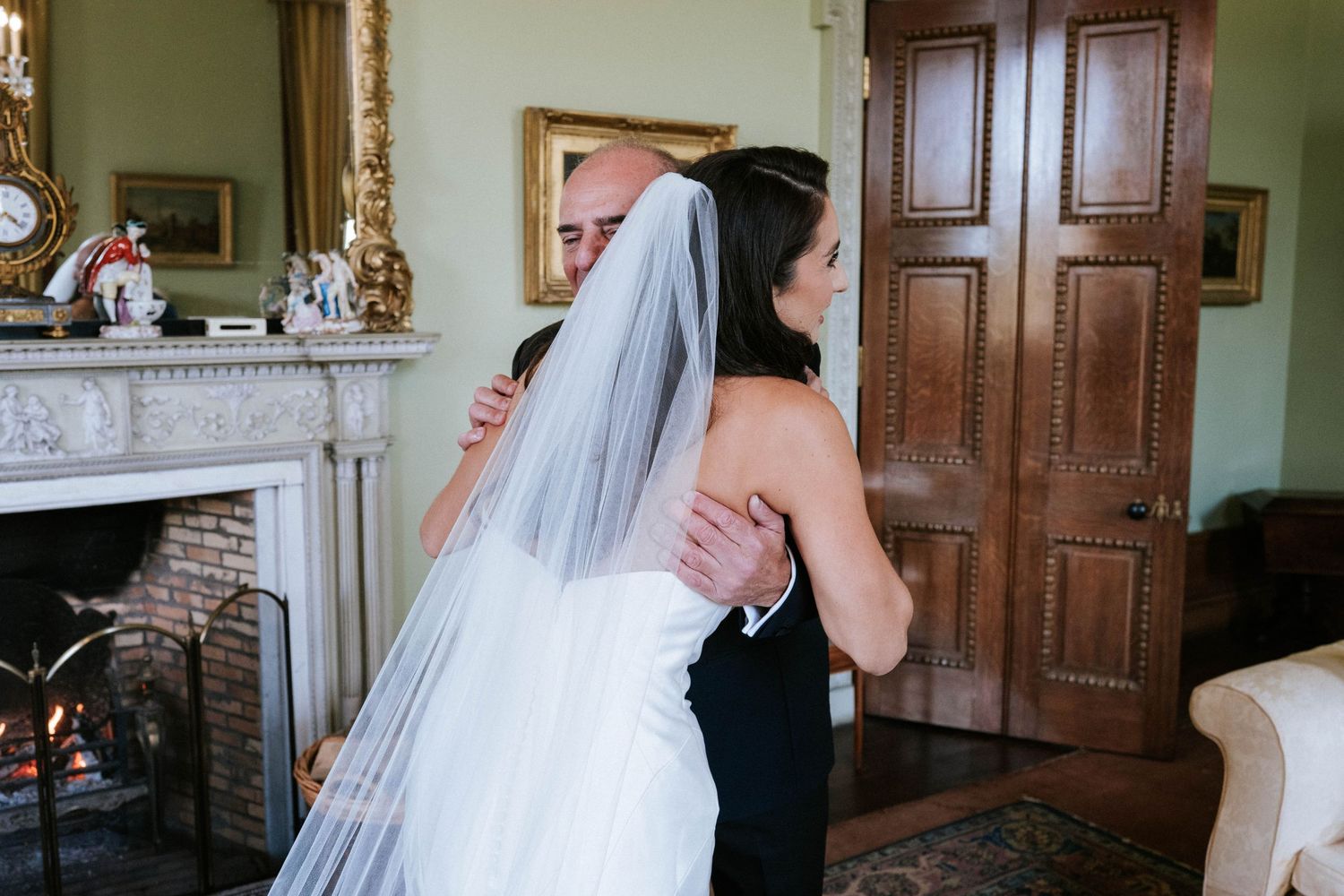 Wedding celebration moment captured in an ornate room with traditional decor.