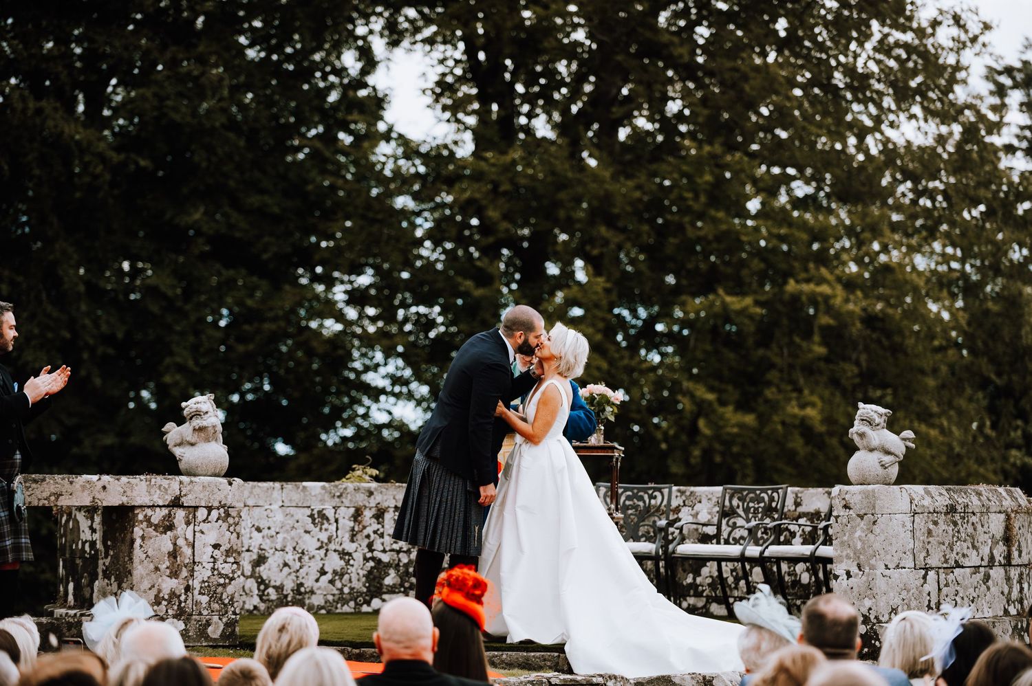 Aberdeen Wedding Photography. Couple shares intimate first look moment in front of stone wall on their wedding day.