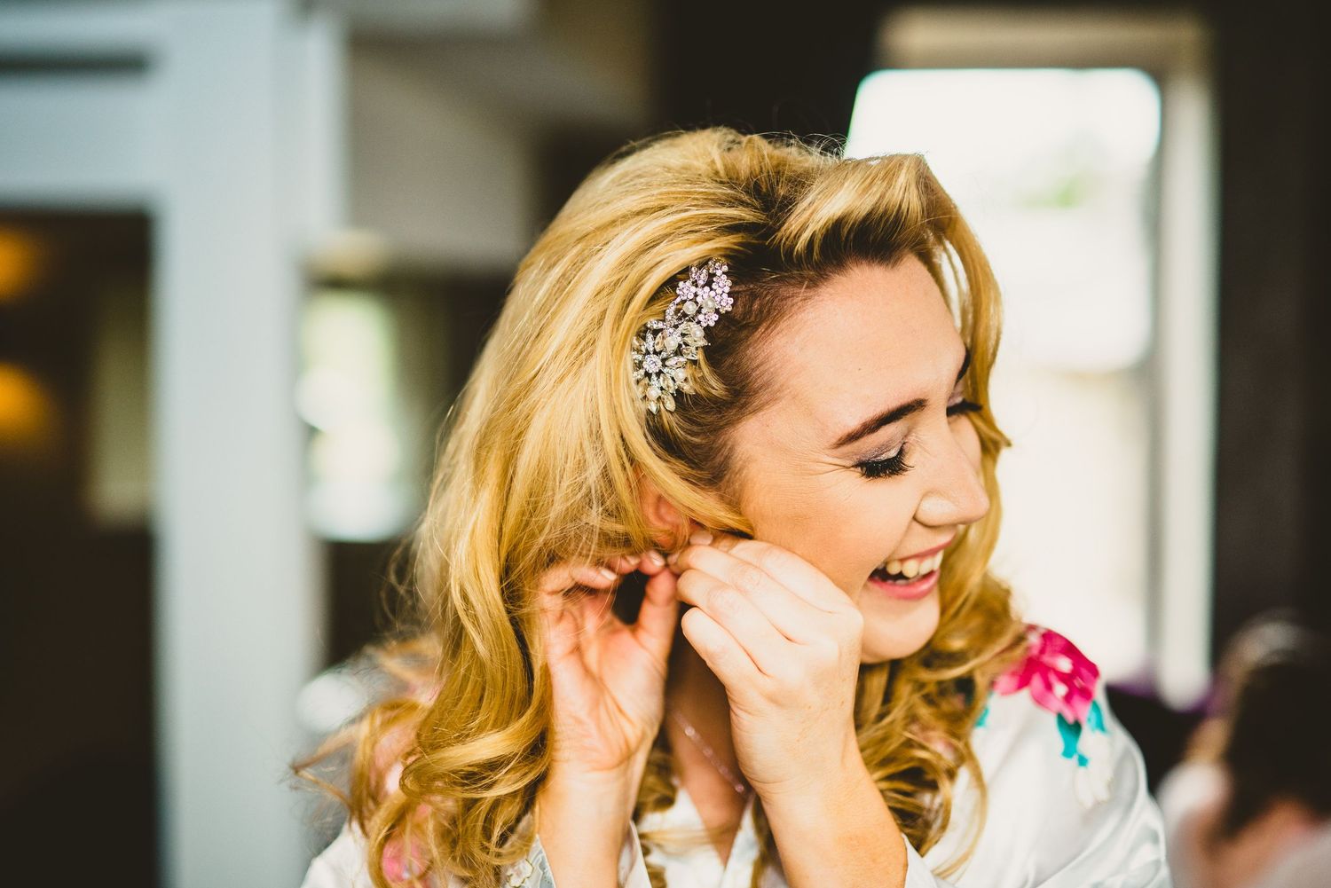 Bride getting ready with hair and makeup preparations for her wedding day.